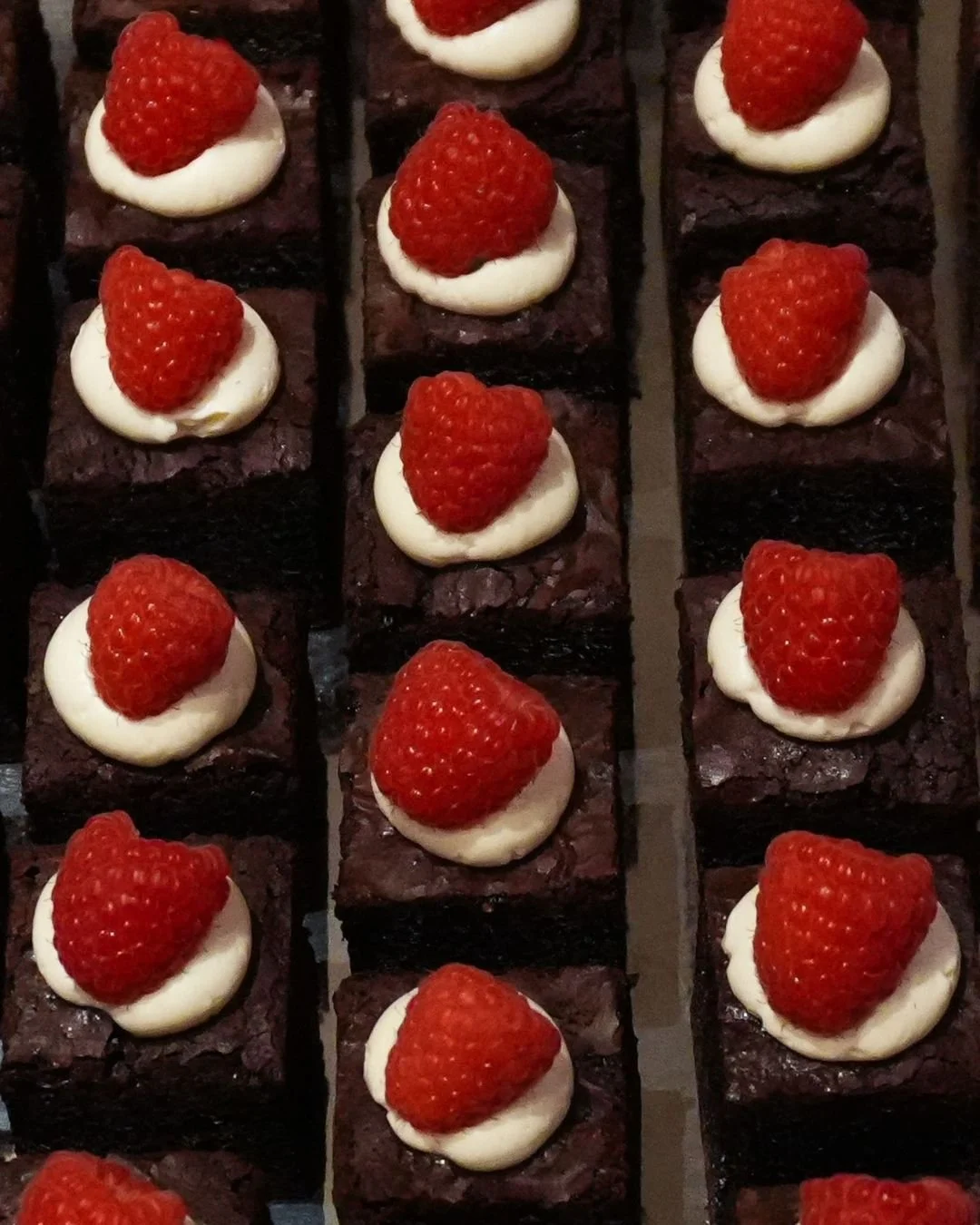 Raspberry-topped brownies served as part of WOW Bakery’s wedding dessert catering in Calgary