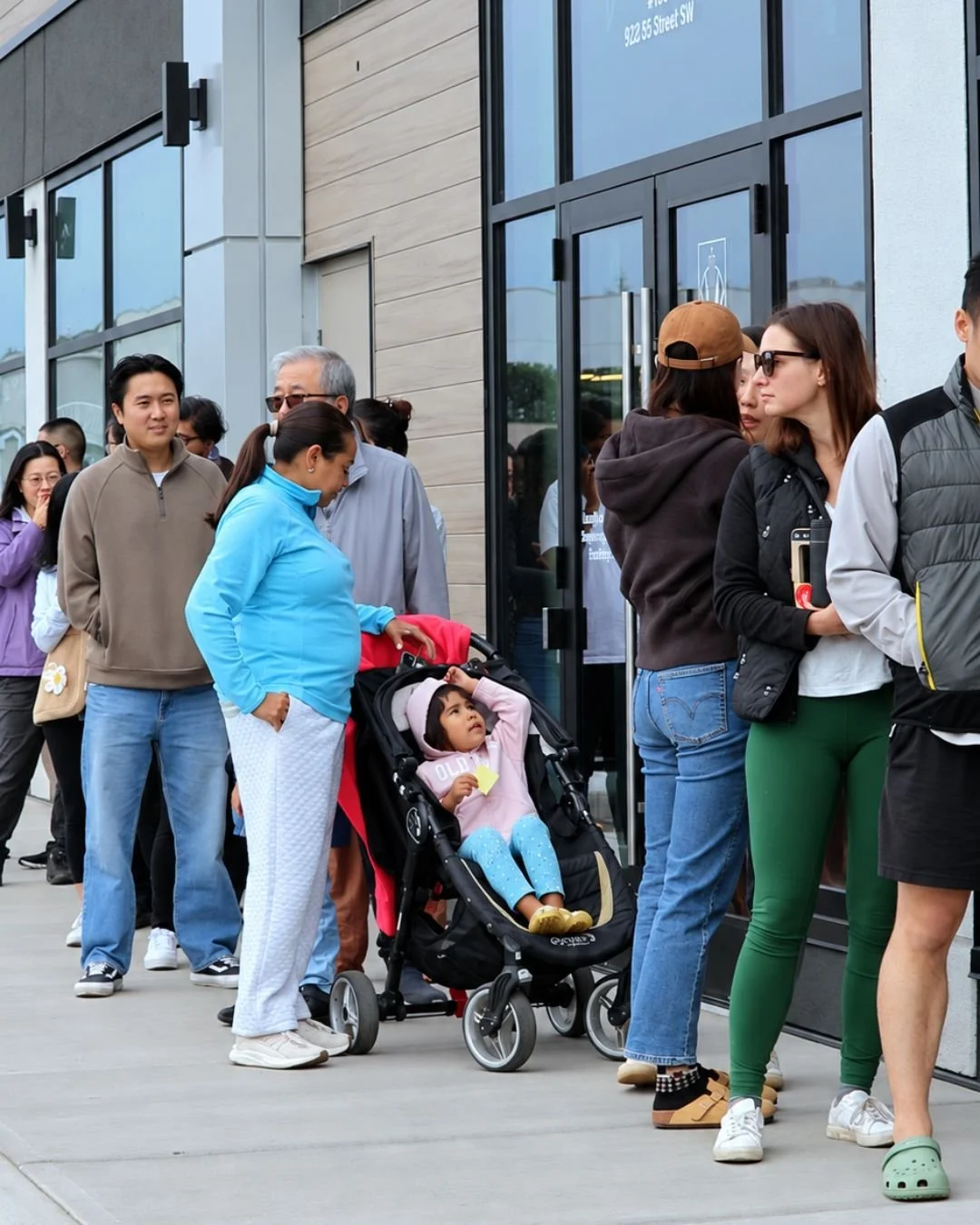 Customers lining up outside WOW Bakery West Springs during its grand opening in Calgary.