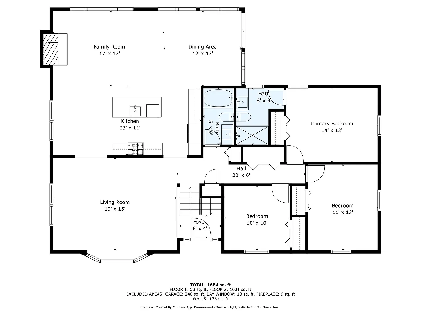 Floor plan of a house showing a living room, kitchen, family room, dining area, foyer, hall, two bedrooms, primary bedroom, and two bathrooms, with measurements for each room.