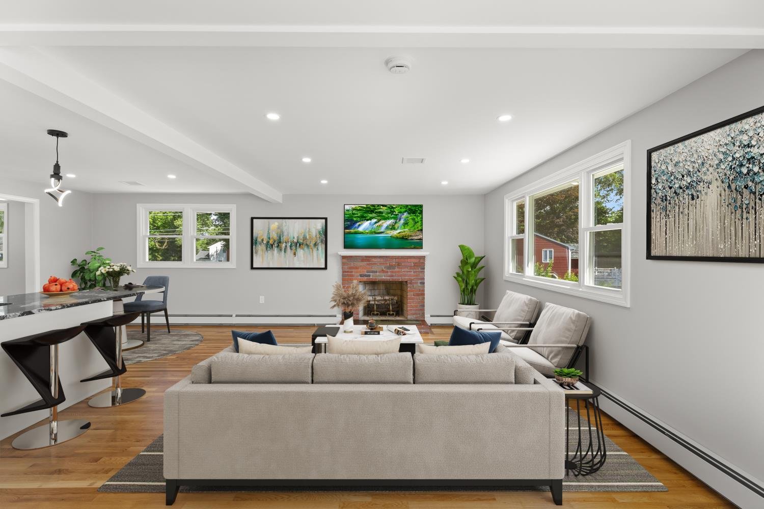 Modern living room with beige sofa, armchairs, fireplace, flat-screen TV, large windows, and decorative paintings.