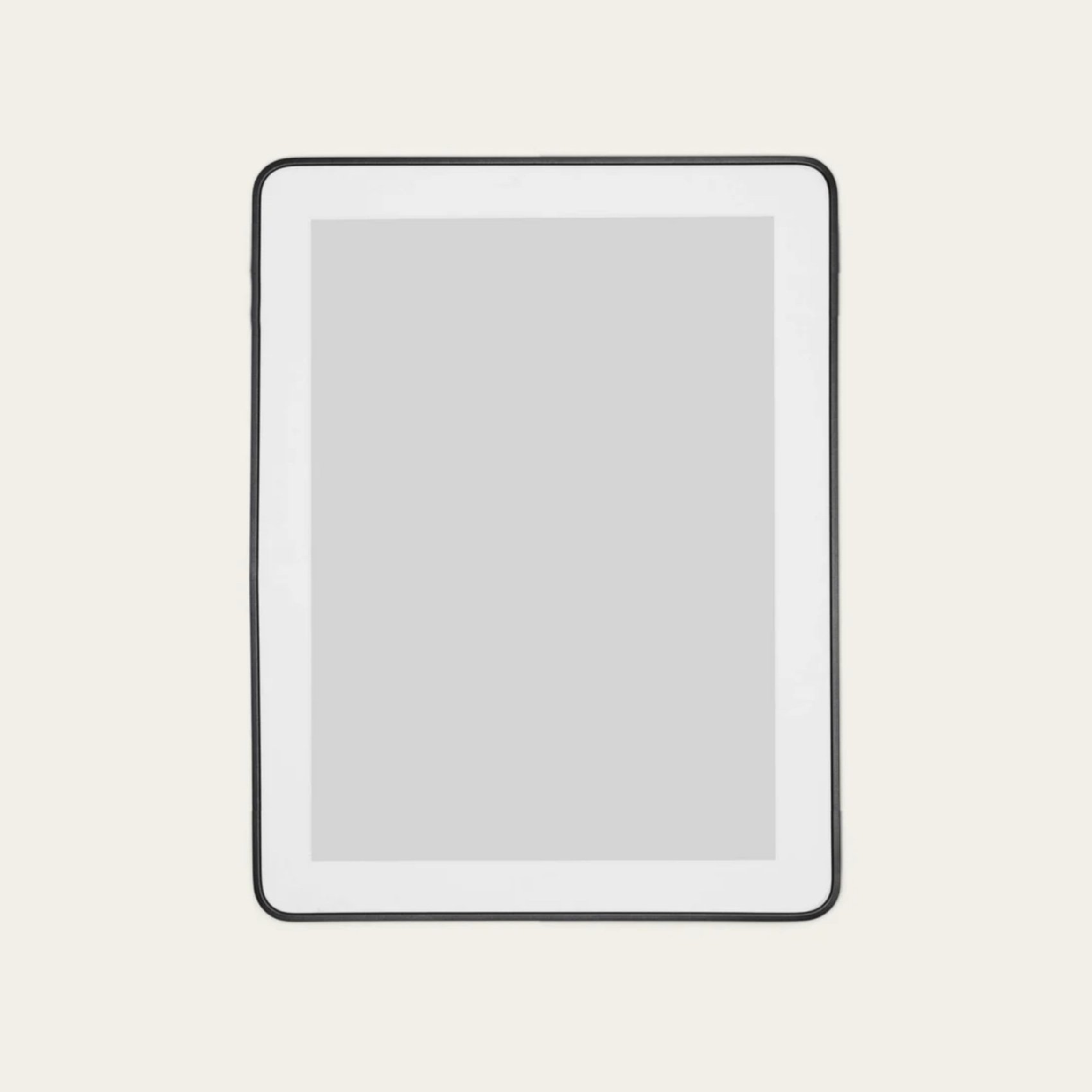 A white tablet with a black border around the screen, placed on a light beige background.