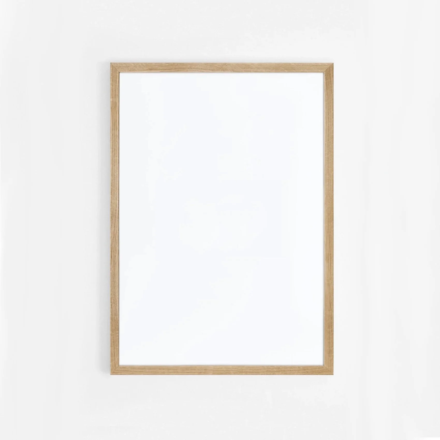 Empty picture frame on white wall.