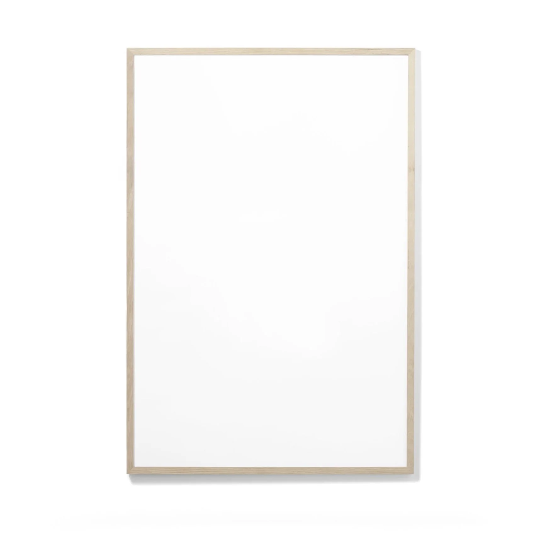 Empty whiteboard with a thin wooden frame standing against a white background.
