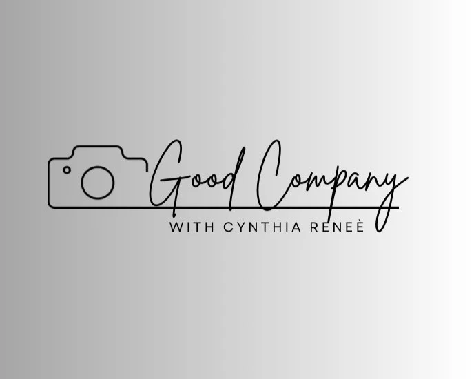 Logo for 'Good Company with Cynthia Renee' featuring a stylized camera icon and elegant handwritten font.
