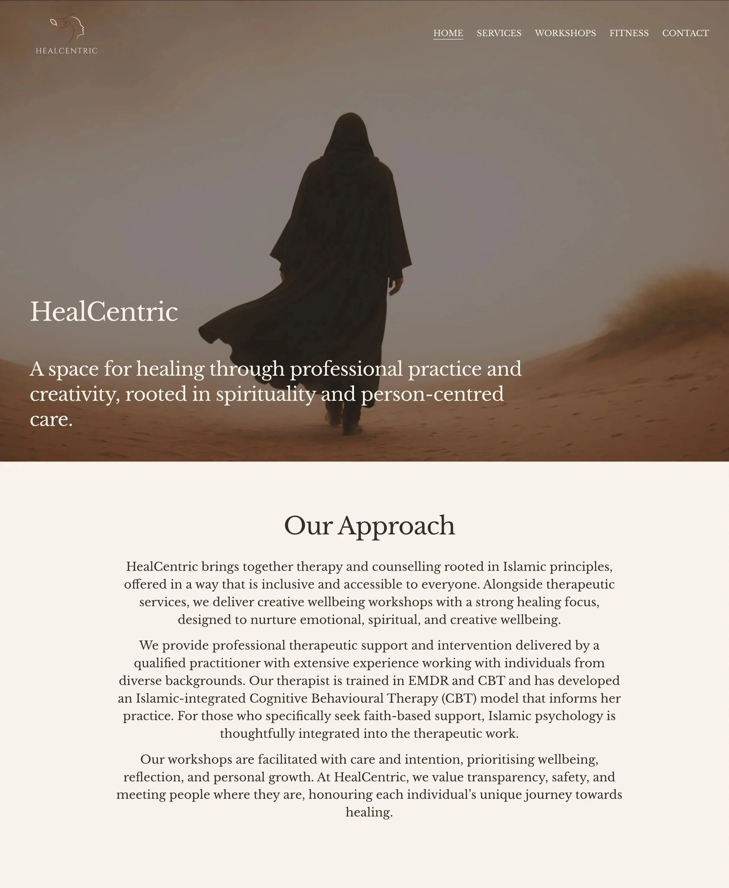 A woman dressed in black walking on a sandy desert landscape during sunset or sunrise, leaving footprints behind.