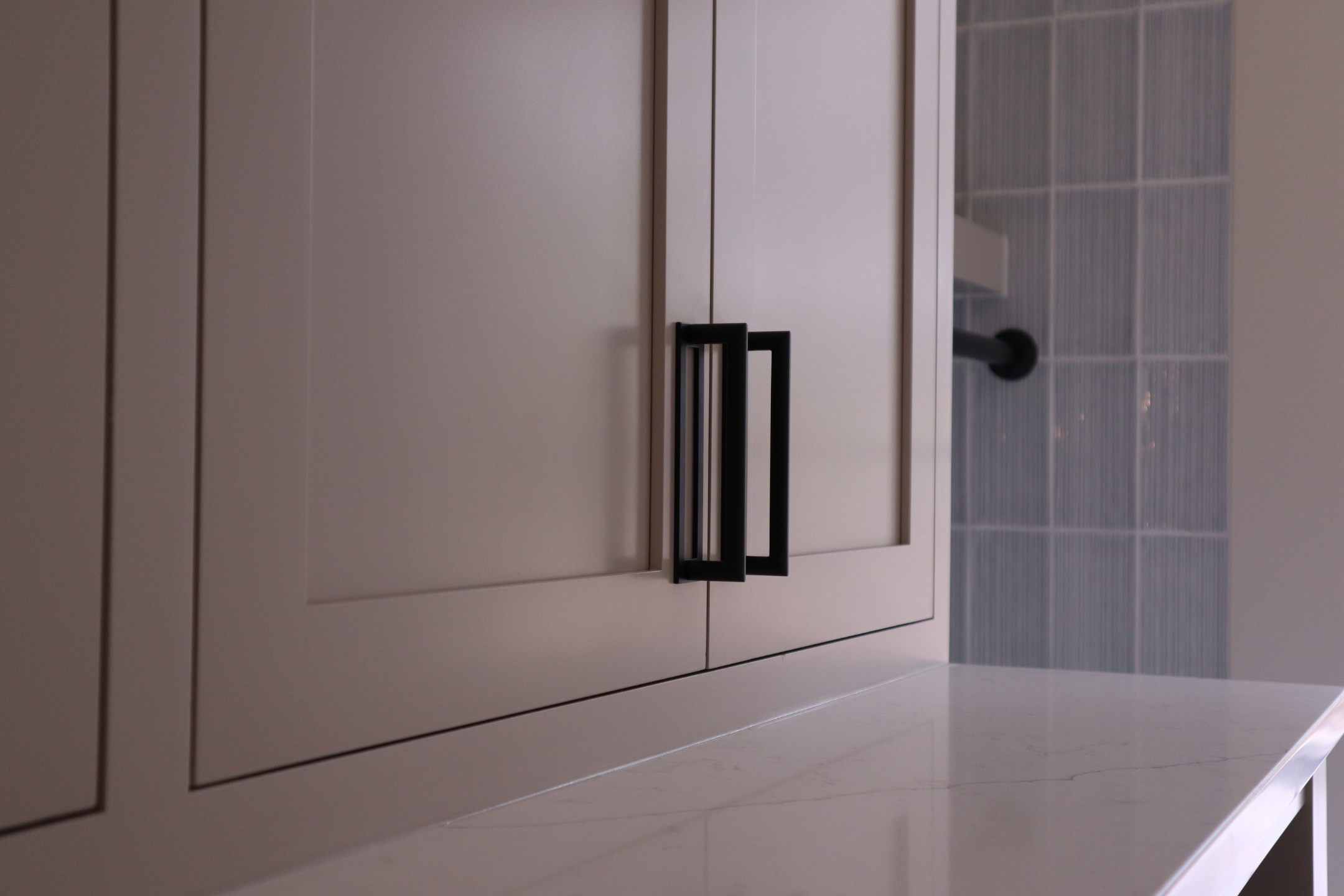 Bathroom cabinet lightwood black hardware.png