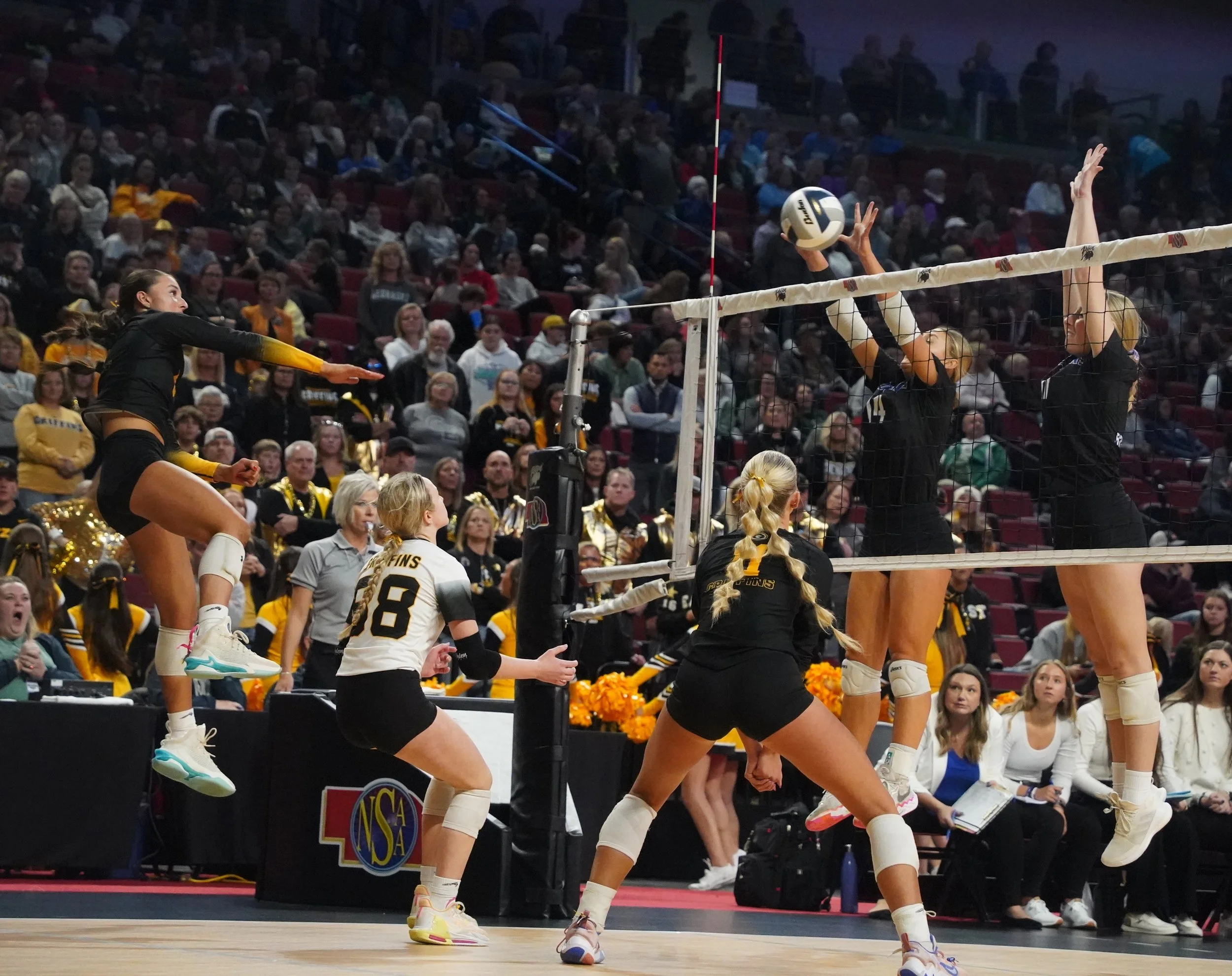 2023 - While playing against Bennington in the first round of the NSAA State Tournament on Nov 2, junior Hayden Hart spikes the ball over the net while juniors Margaret Williams and Hailey Levinson get set up to receive. The team lost the game in thr