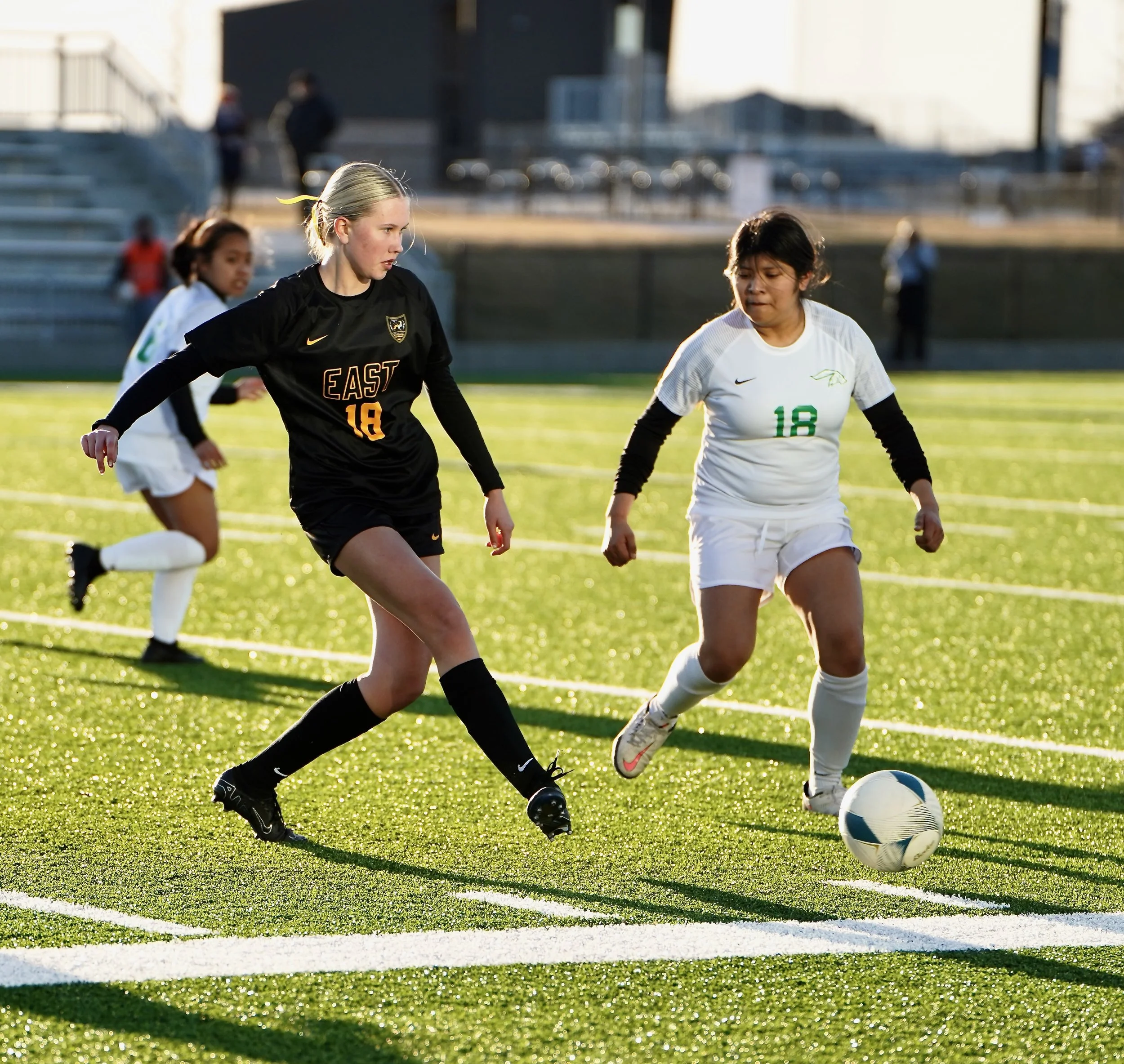 2024 - In the first game of the season on March 18, freshman Morgan Grant kicks the ball away from Benson's Karen Villanueva Roman to advance the ball. The game marked the girl's first shutout of the season, with a score of 10-0 over the Bunnies. 