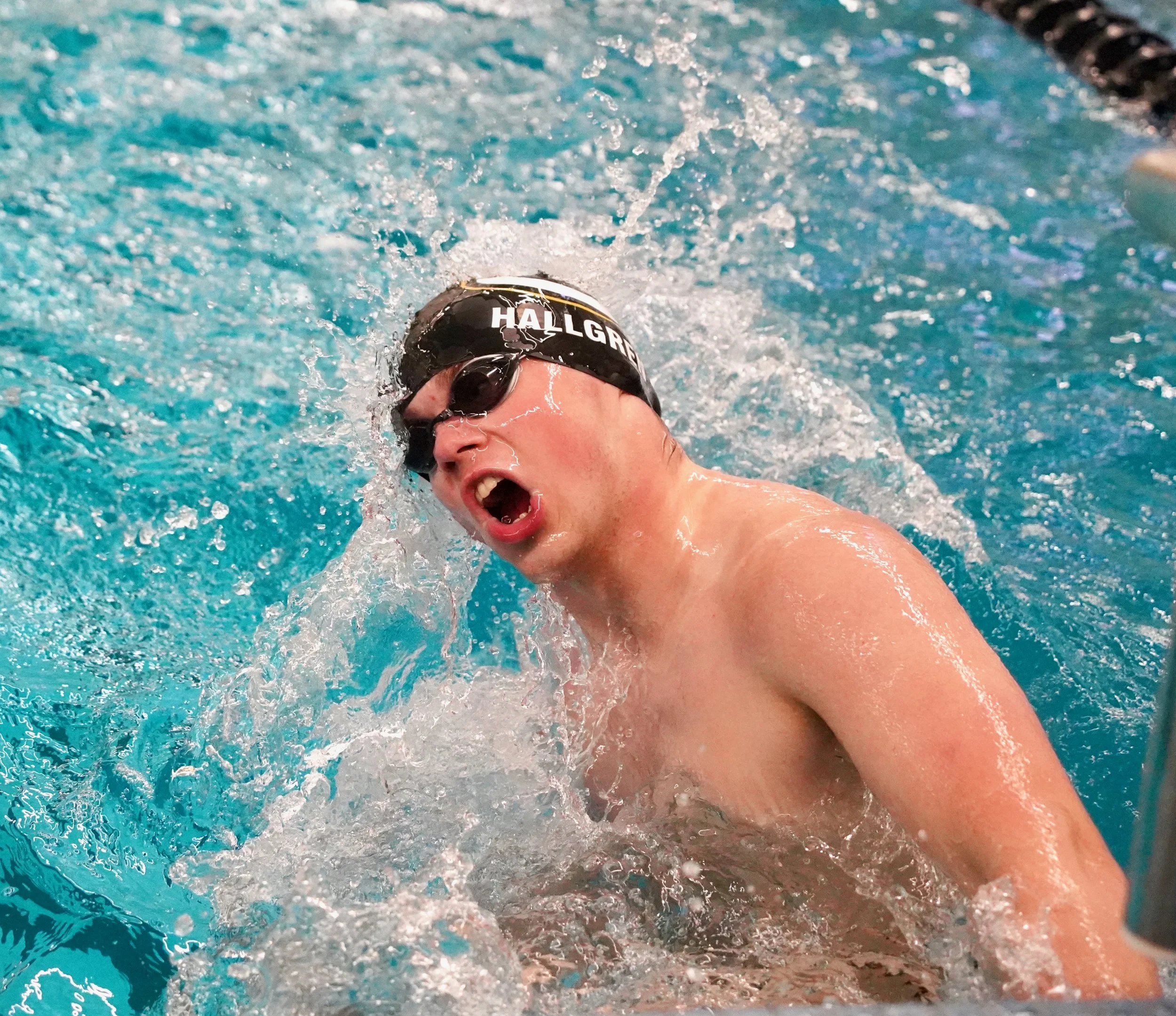 2023 - Swimming the 100-yard breaststroke on Nov. 21, junior Alex Hallgren takes a breath at the wall. Hallgren placed first; however, it wasn't an official meet, rather the swim team's mock meet to determine varsity, JV and reserve swimmers. 