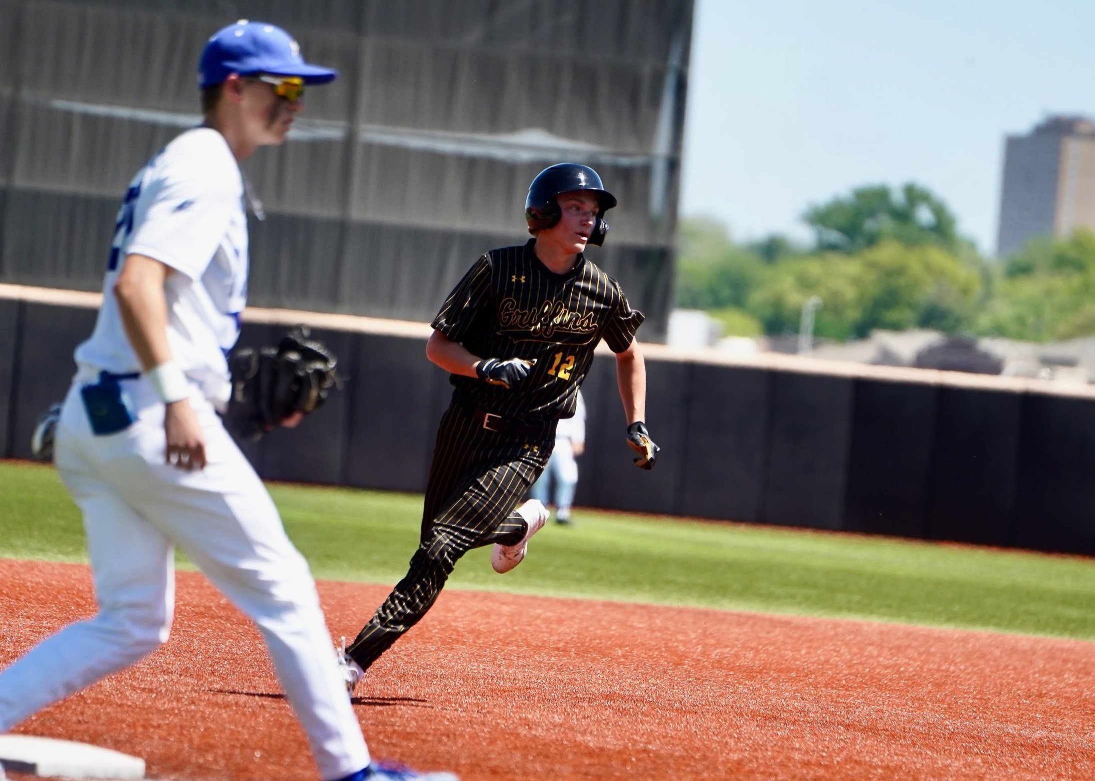 2024 - Making his`way toward third base at the state quarterfinals against Plattsmouth on May 11, sophomore Seth Kragel keeps his eye on the ball. Kraegel was safe on third, but didn't end up scoring a run. 