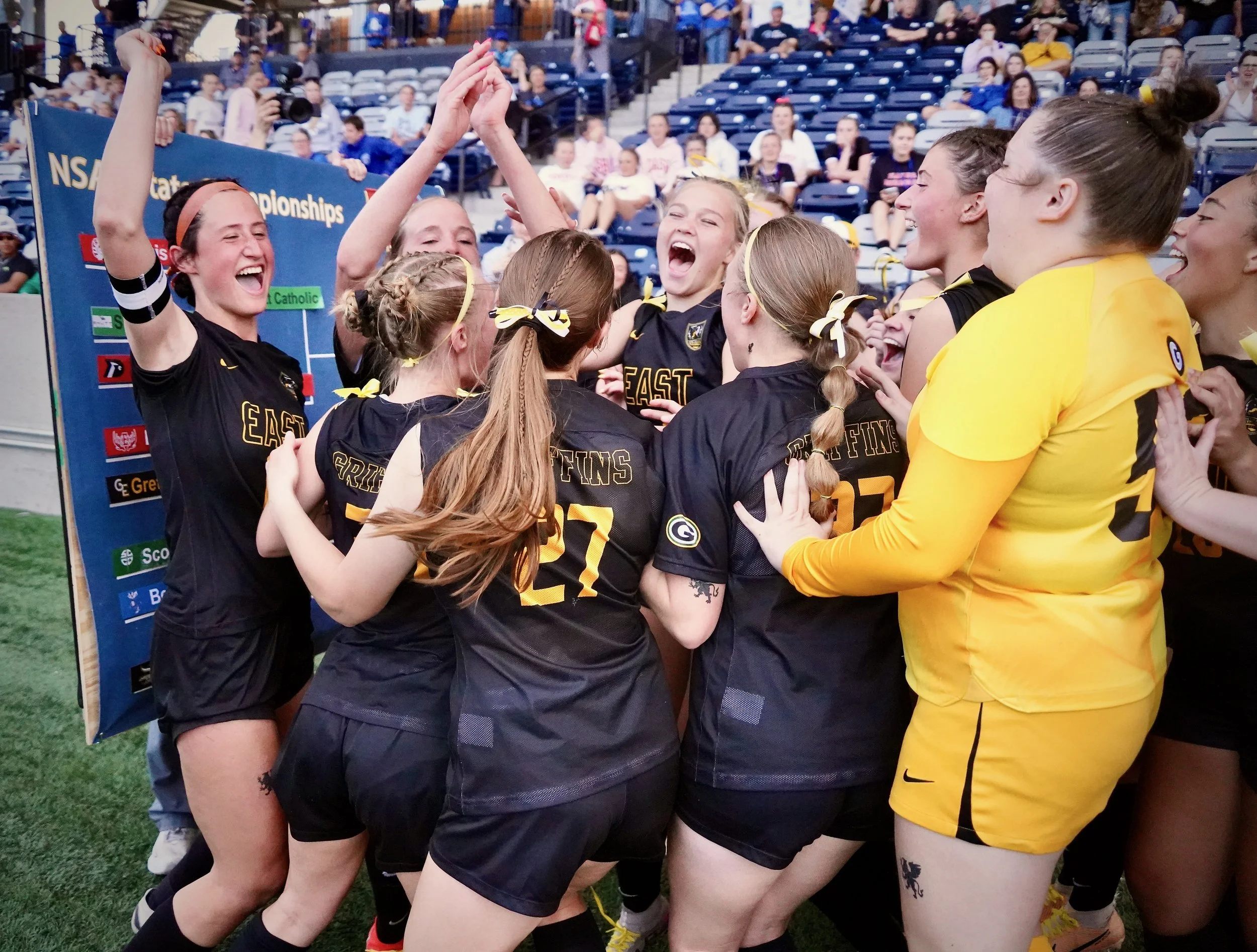 2024 - After placing their team's sticker on the board marking their advancement on May 9, the girls soccer team celebrates their 12-3 win over Scotus Central Catholic in the state quarterfinals. The team went on to defeat the Bennington Badgers in t