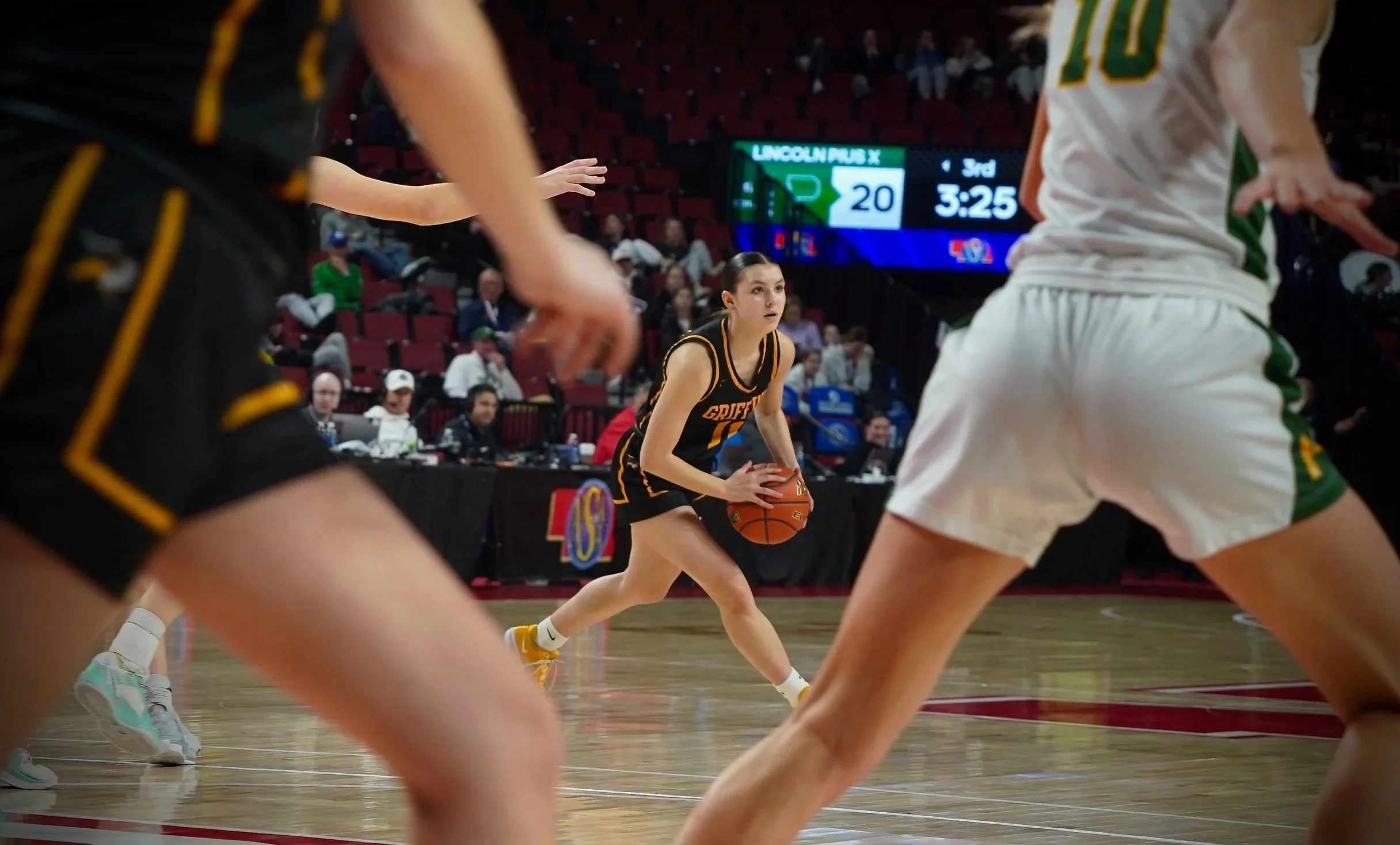 2025 - At the state quarterfinals against Lincoln Pius X on March 6, sophomore Maggie Pfaff looks to make a pass in the third quarter. The team won 35-28 and advanced to the semifinals. 