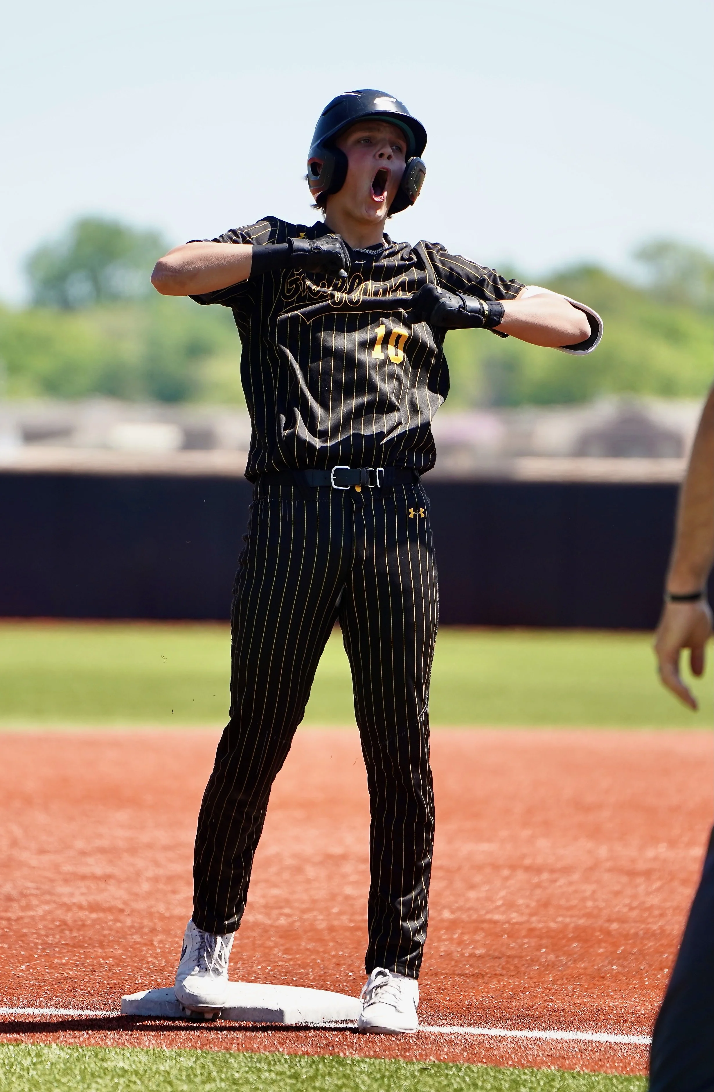 2024 - After running to second base, sophomore Carson Hermann beats his chest. At the state quarterfinals against Plattsmouth, Herrmann had a strong hitting game, getting two hits in four chances to bat, and scoring one run. The team won 5-4 on May 1