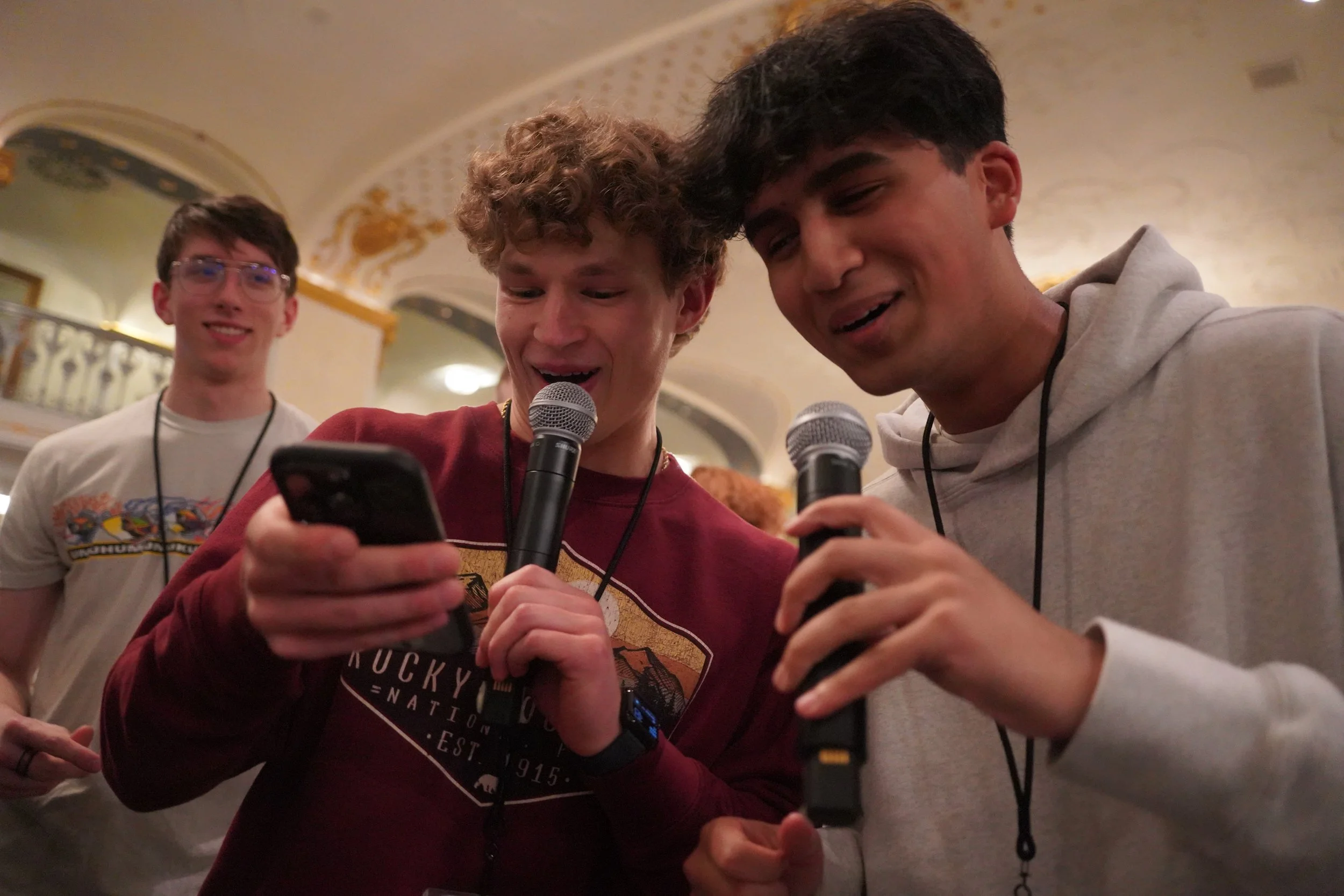 2026 - Attempting to sing-along to "Low" by Flo Rida, Jackson Wondercheck, and Arya Kashyap read the lyrics from Wondercheck's phone. Wondercheck represented Nebraska, and Kashyap represented Washington at the United States Senate Youth Program in Wa