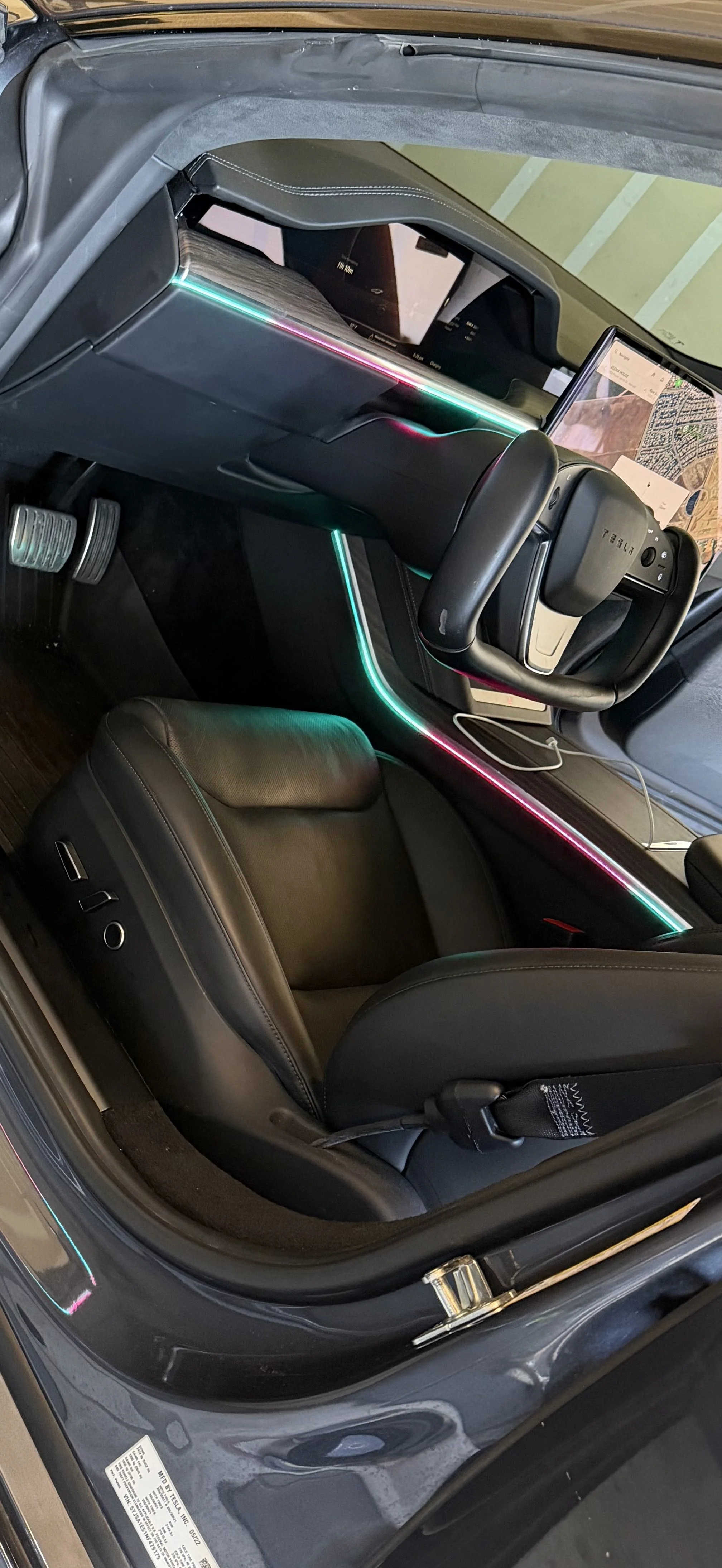 Custom automotive electronics installation featuring premium interior lighting and multimedia upgrades.