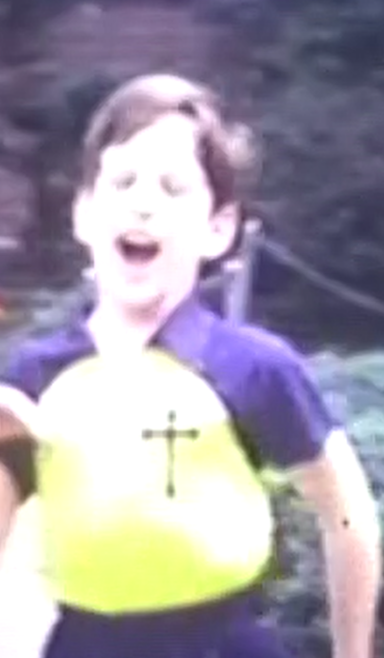 Rich wearing St. Joan of Arc track jersey, mid 1960s 