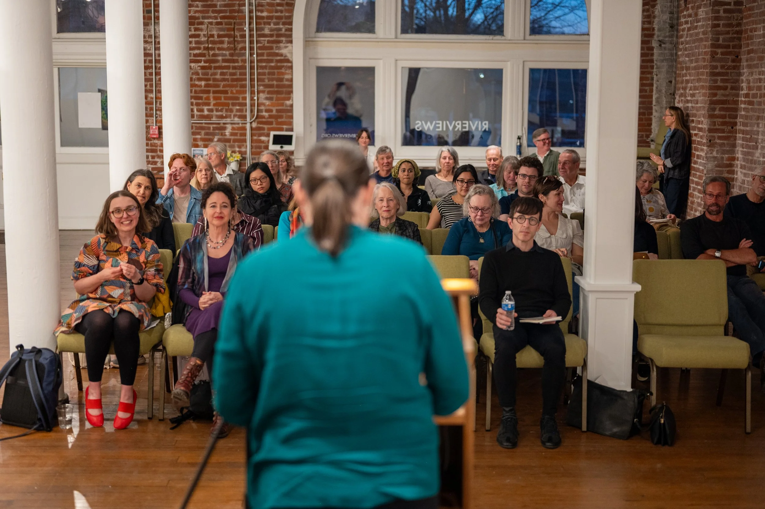 group seated for event in main gallery.jpg