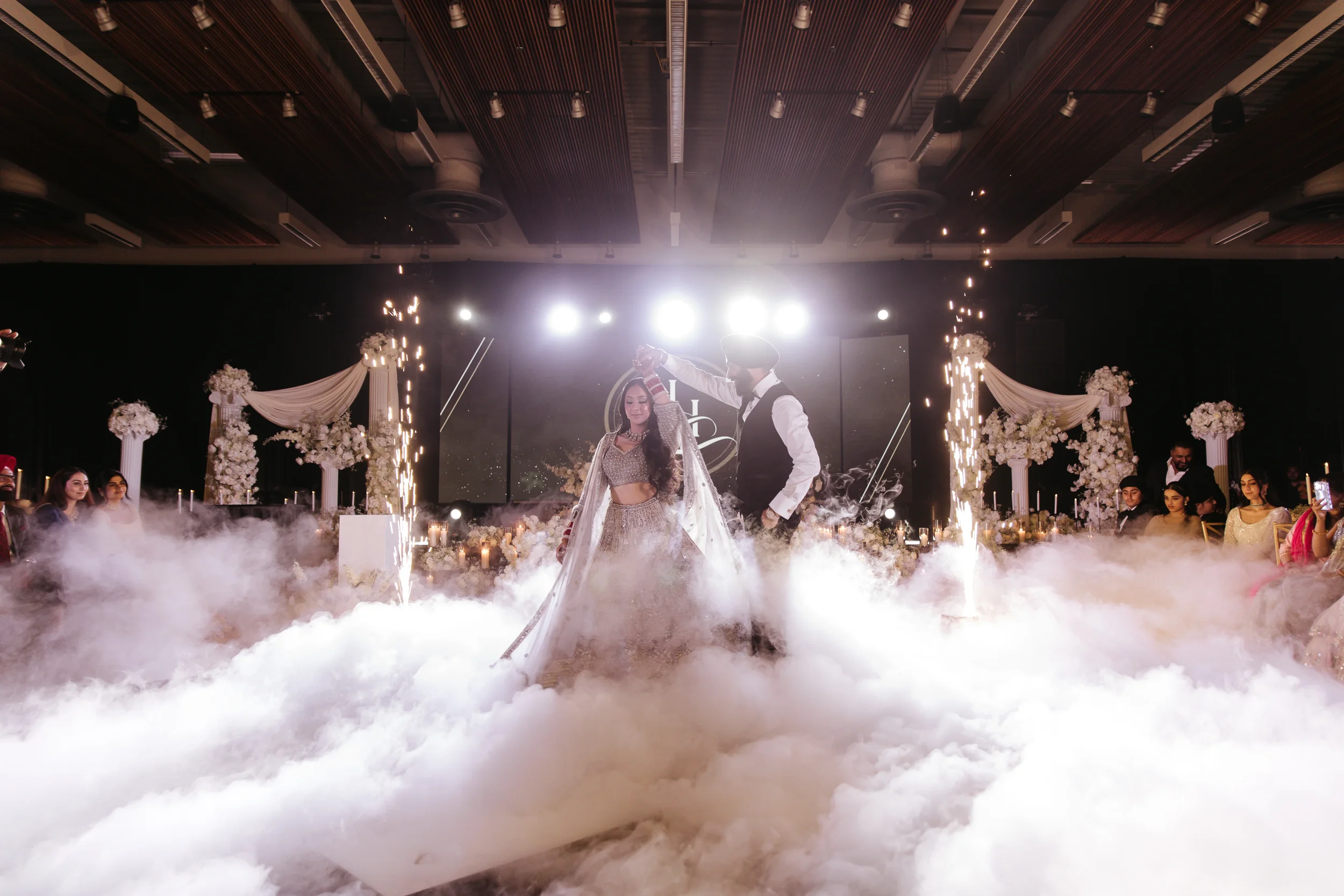 luxury wedding. first dance with fog and sparkler. Weddings at Mcgavick Conference Center