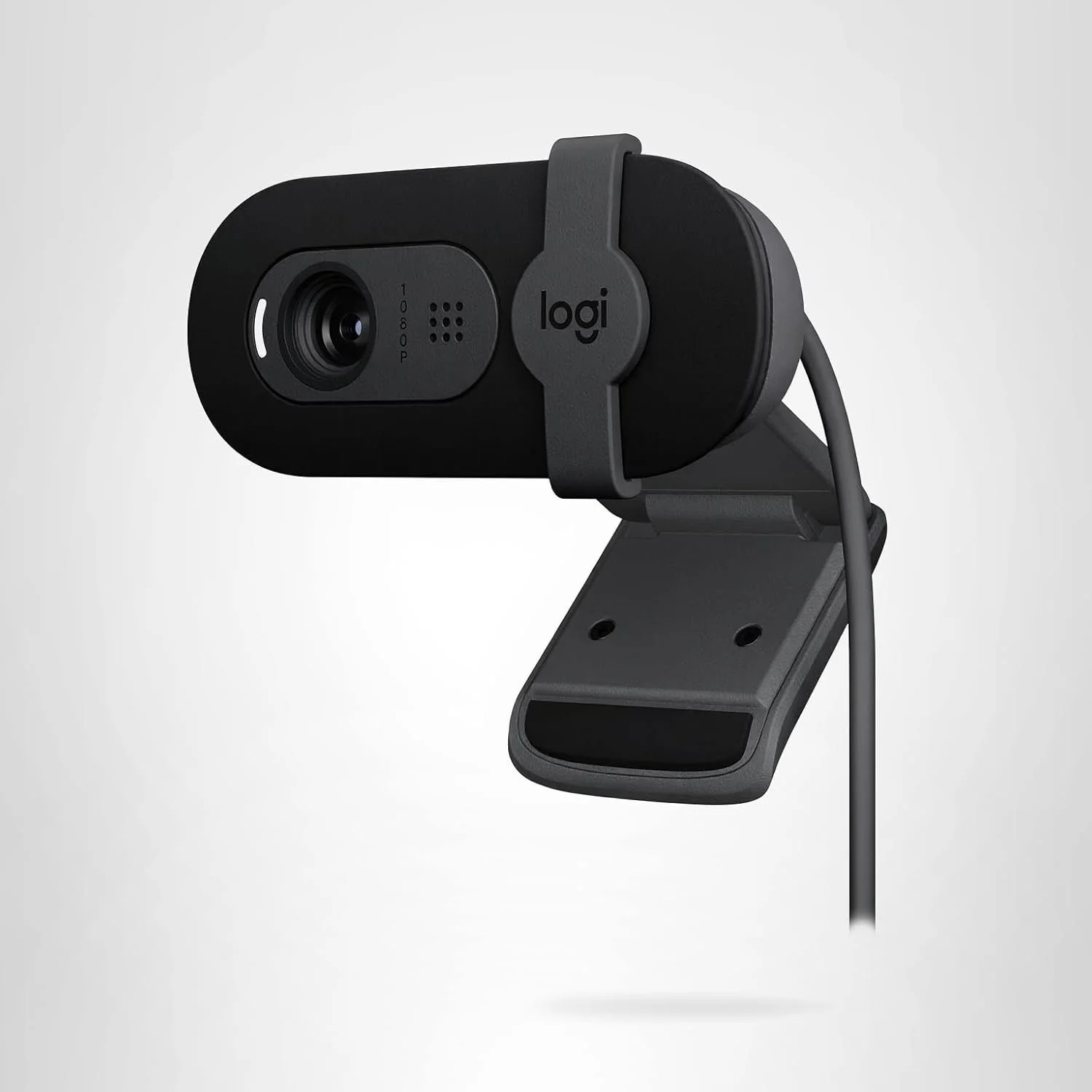 A black Logitech webcam mounted on a wall or surface with a gray adjustable stand and a USB cable attached.