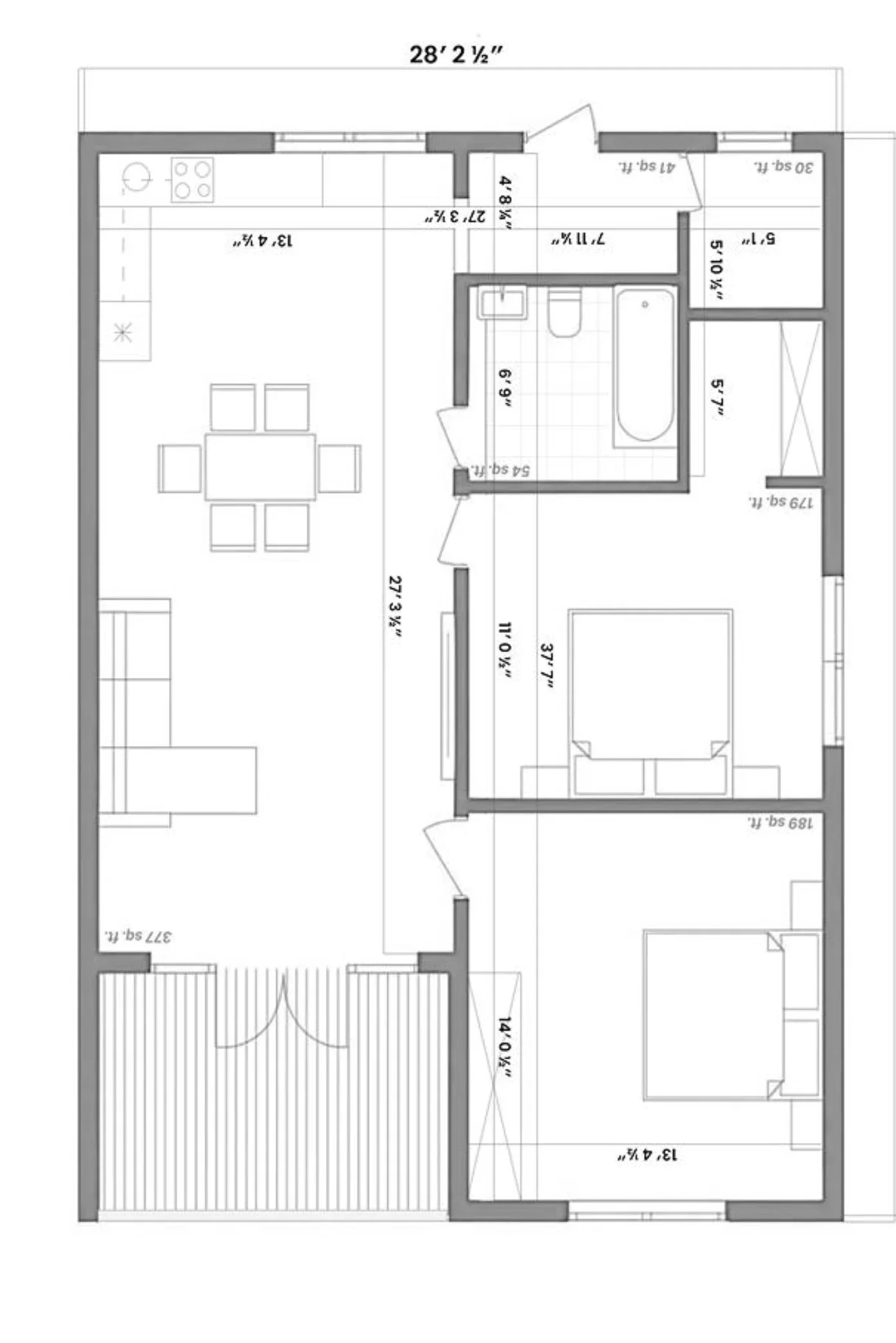 Floor plan of a house showing layout of rooms including a living area, dining area, kitchen, bedroom, and bathroom, with measurements in feet and inches.