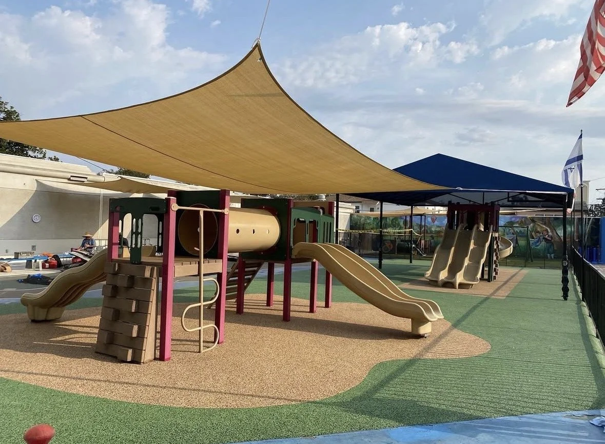 Oranssi technician working on a roof project