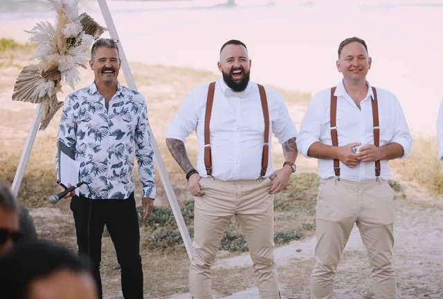 The celebrant (Anthony Spark), the groom and the best man, waiting for the bride at a beach wedding. 