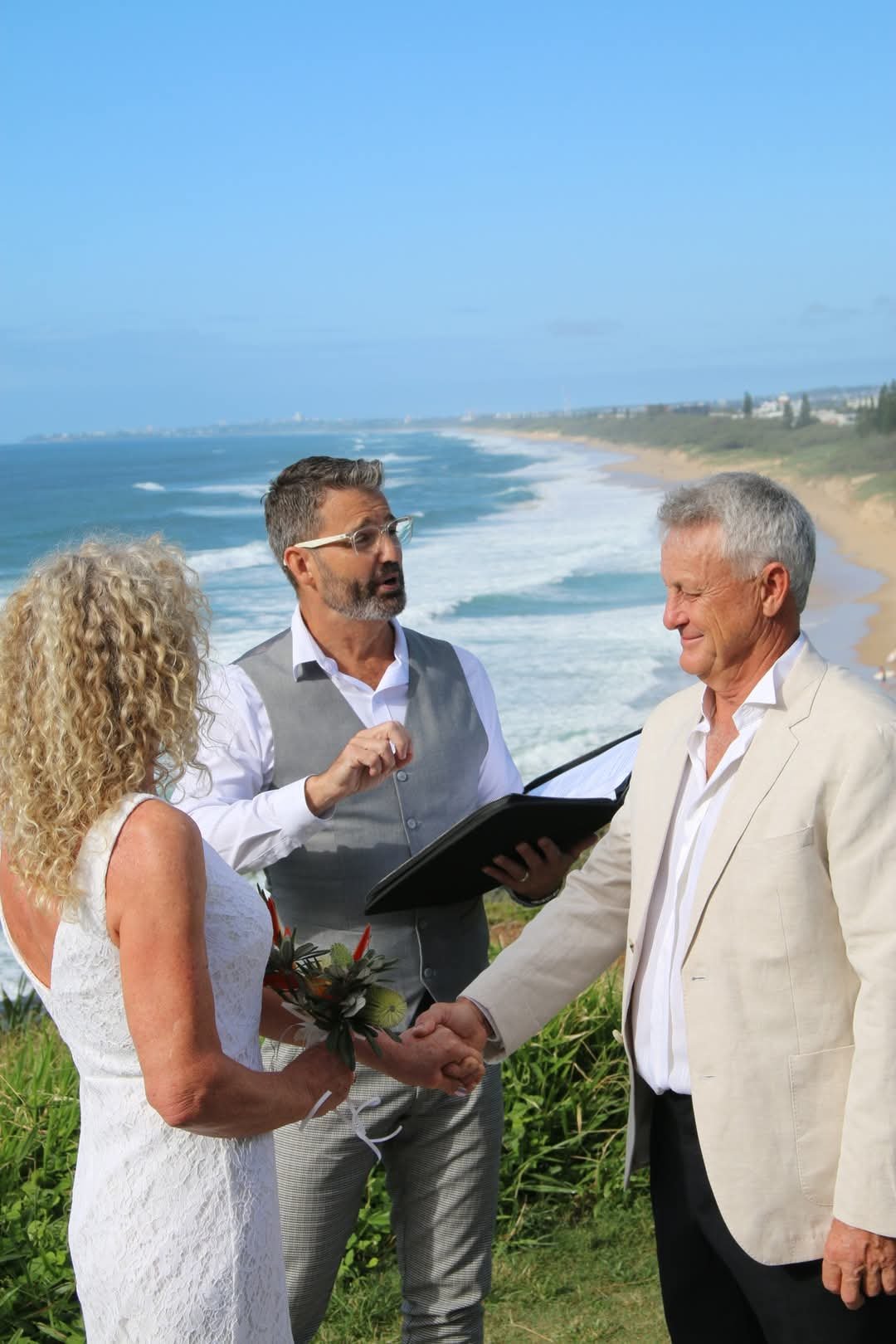 Anthony Spark officiating a wedding at Point Cartwright on the Sunshine Coast. Locations can make all the difference. The Sunshine Coast is spoilt for choice with locations for weddings