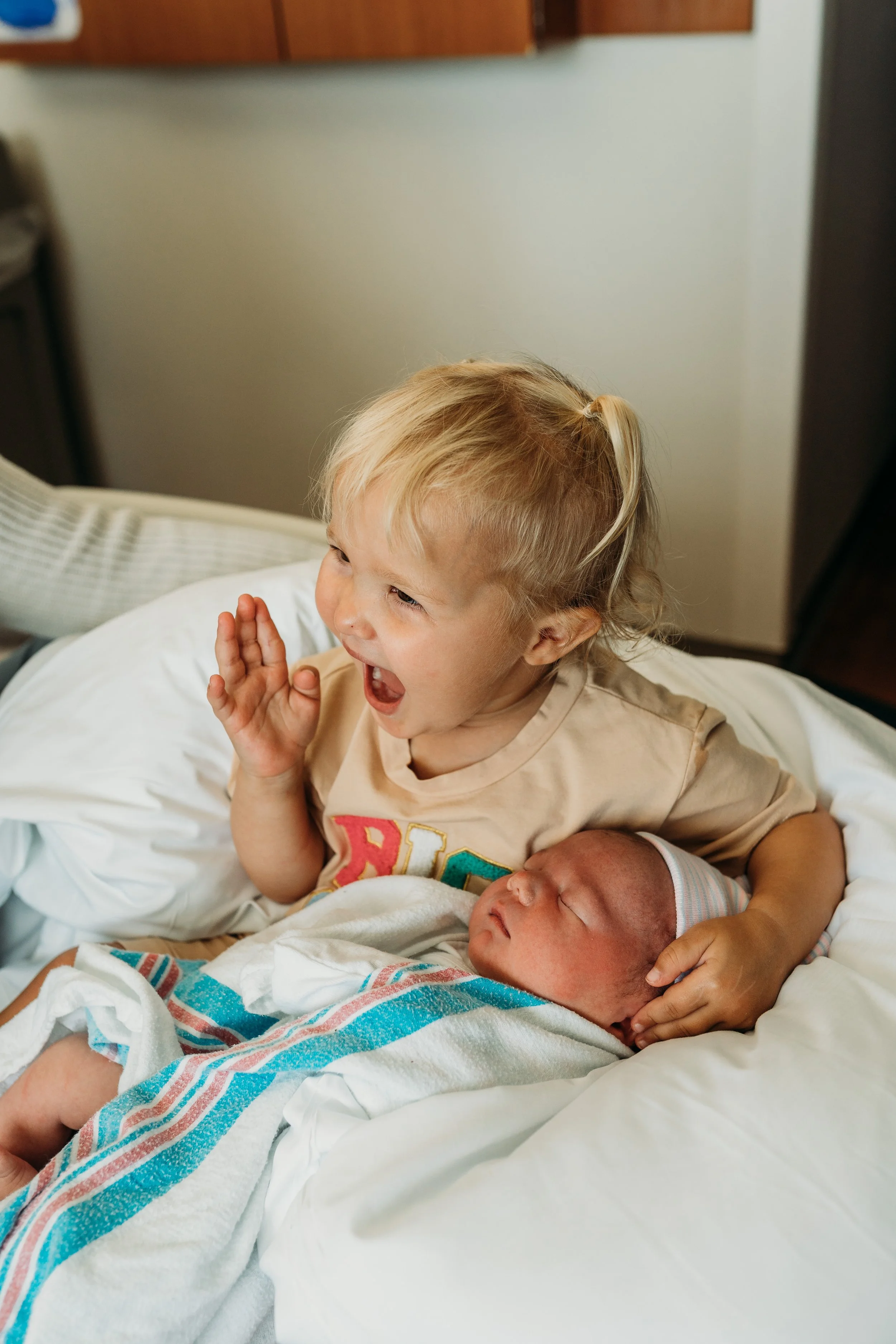 Big sister excited to meet new baby sibling in Fresh 48 photo session, Melbourne, FL