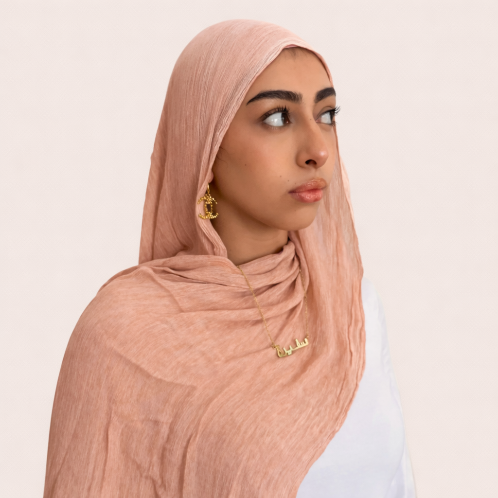 Portrait+of+a+woman+in+peach+hijab.png