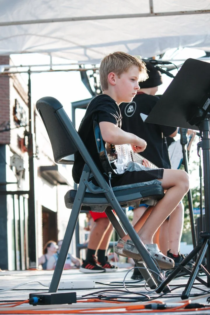 Anthem Road Academy boy playing guitar.jpg