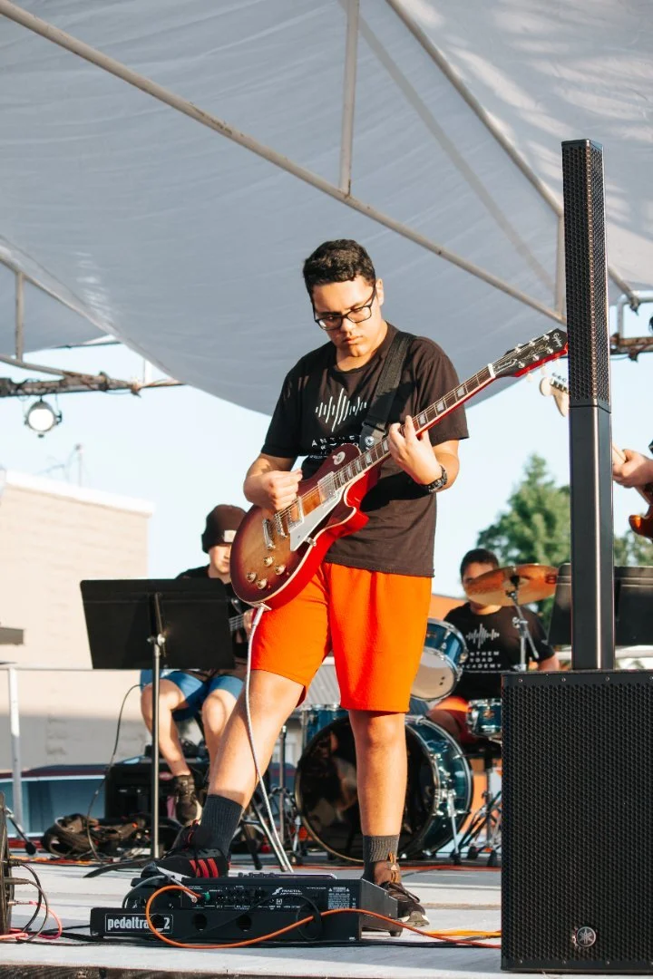 Anthem Road Academy boy and guitar.jpg