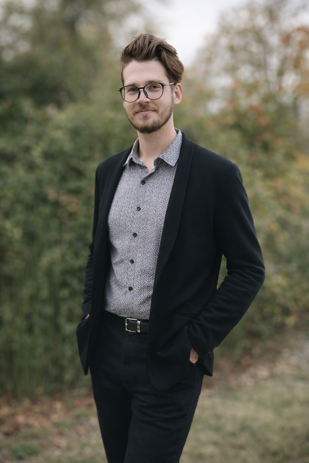 Portrait of wedding DJ Stephen Downing outdoors in North Carolina, wearing formal attire.