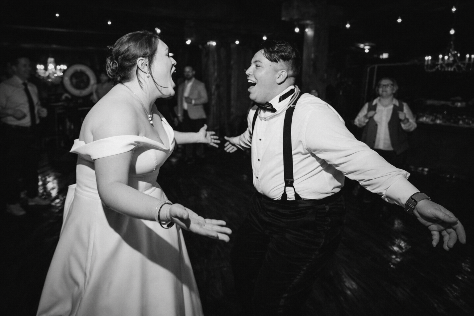 Bride and groom dancing together at a classic black and white wedding reception in Winston-Salem
