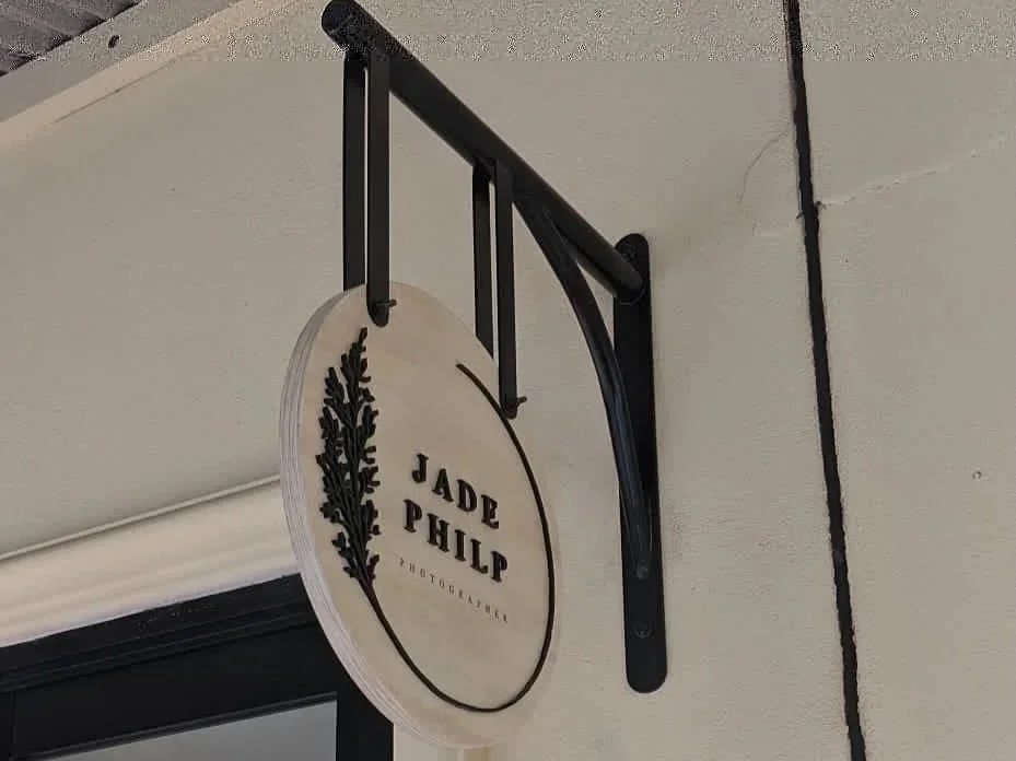 Custom wall bracket with timber panel and laser cut acrylic lettering