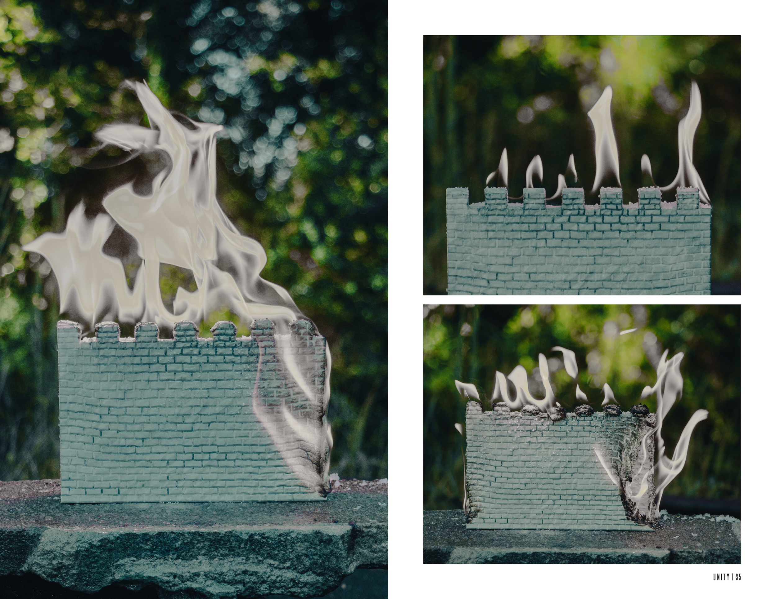 A miniature brick wall with flames resembling a castle battlement, burning on a stone surface outdoors.