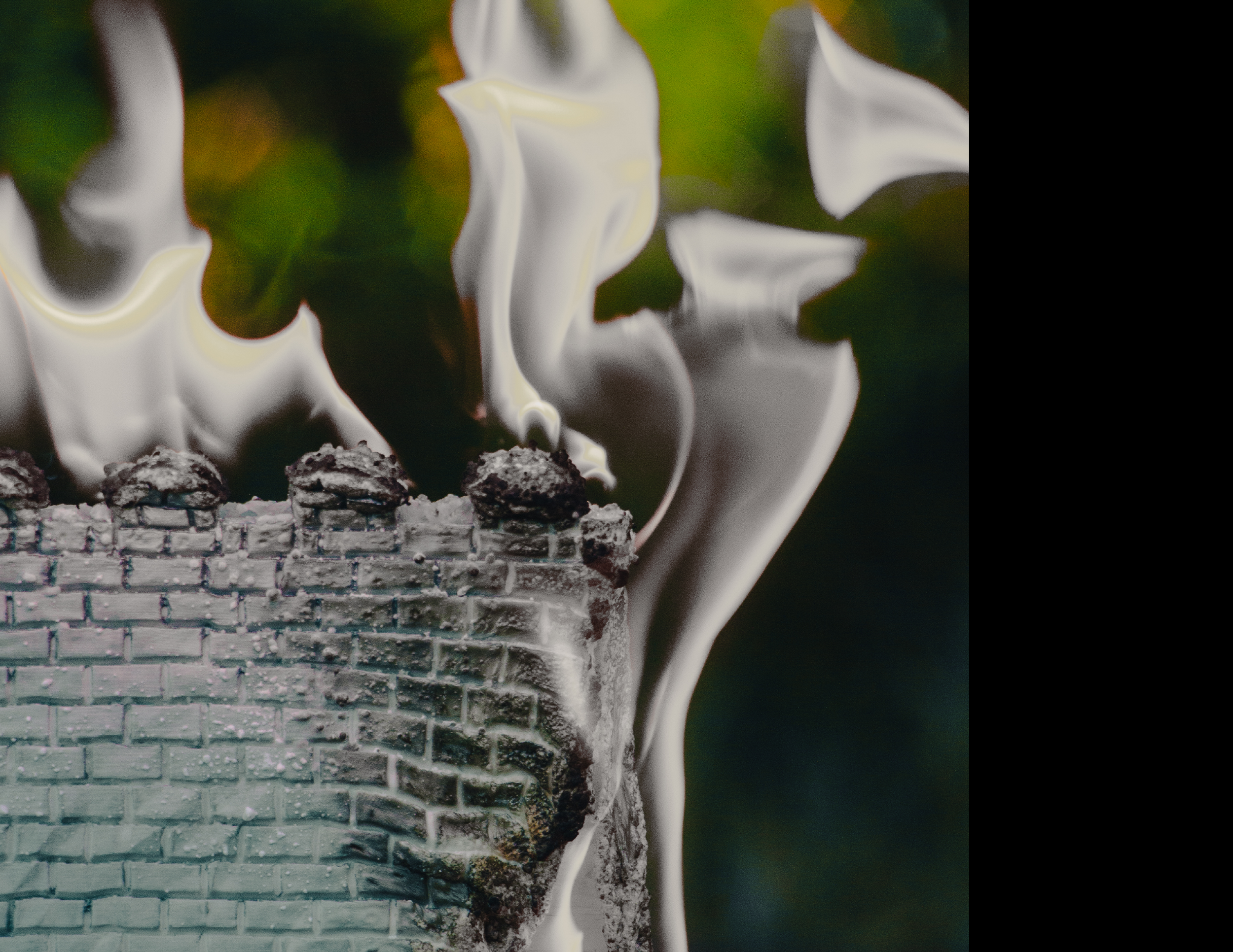 Close-up of a 3D printed wall sculpture engulfed in white flames.