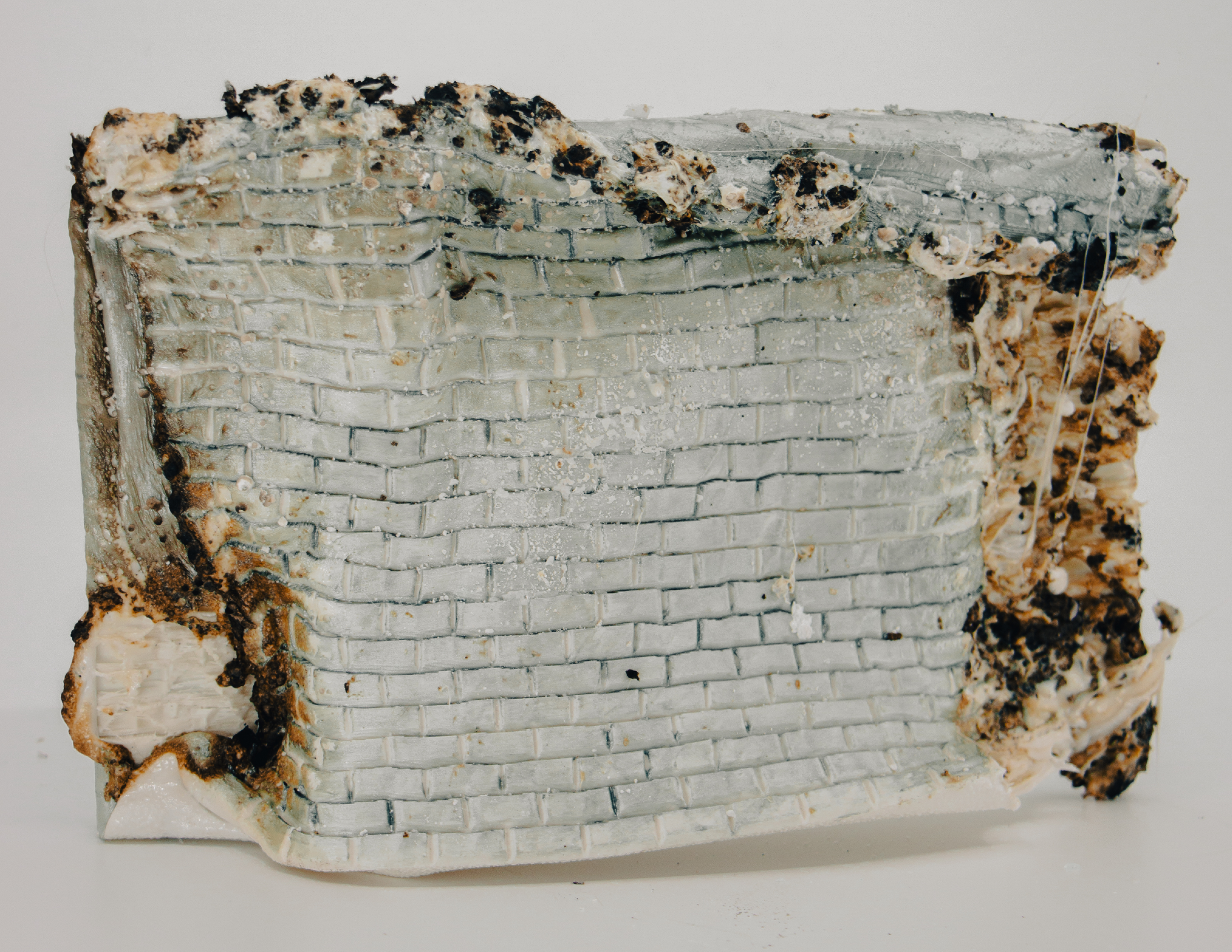 The wall sculpture after being burned.