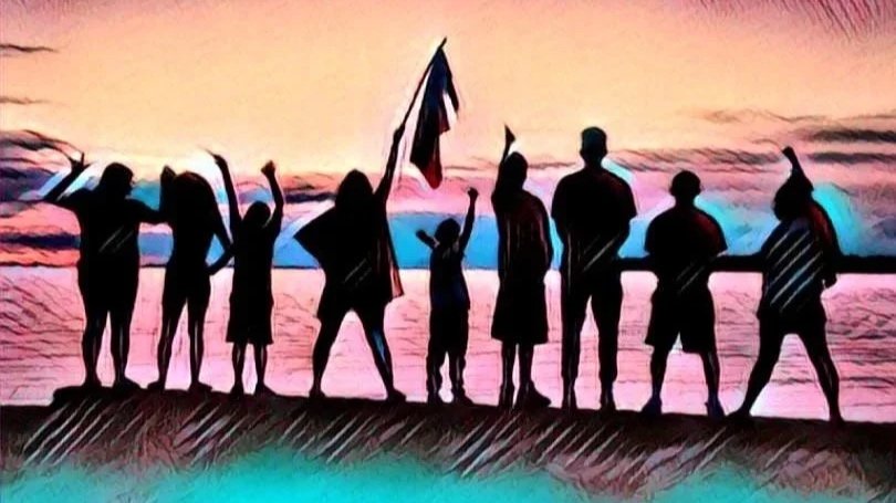 Friends for Life. Silhouettes of people and children standing on a beach at sunset, holding flags and raising their hands.