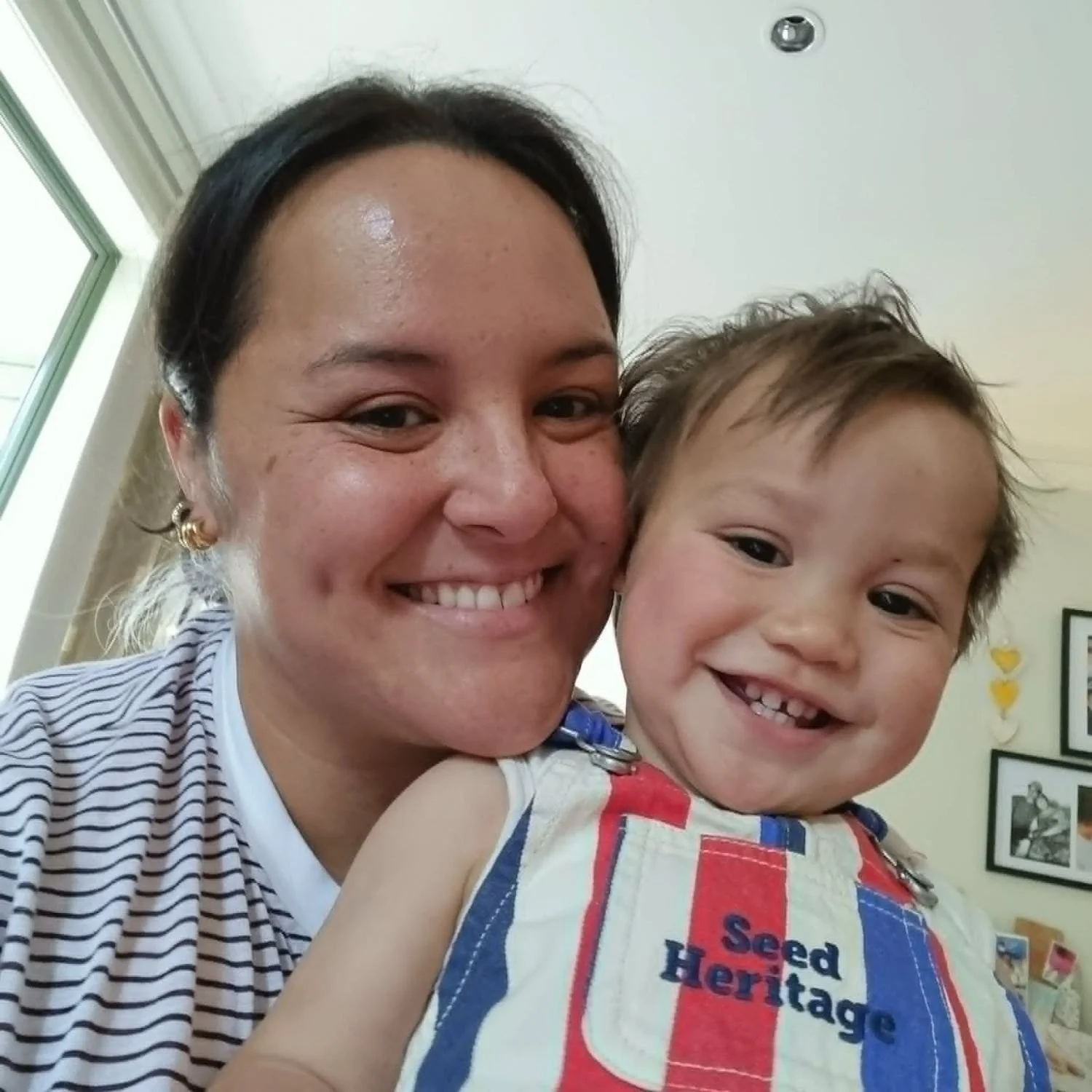 teacher and baby smiling