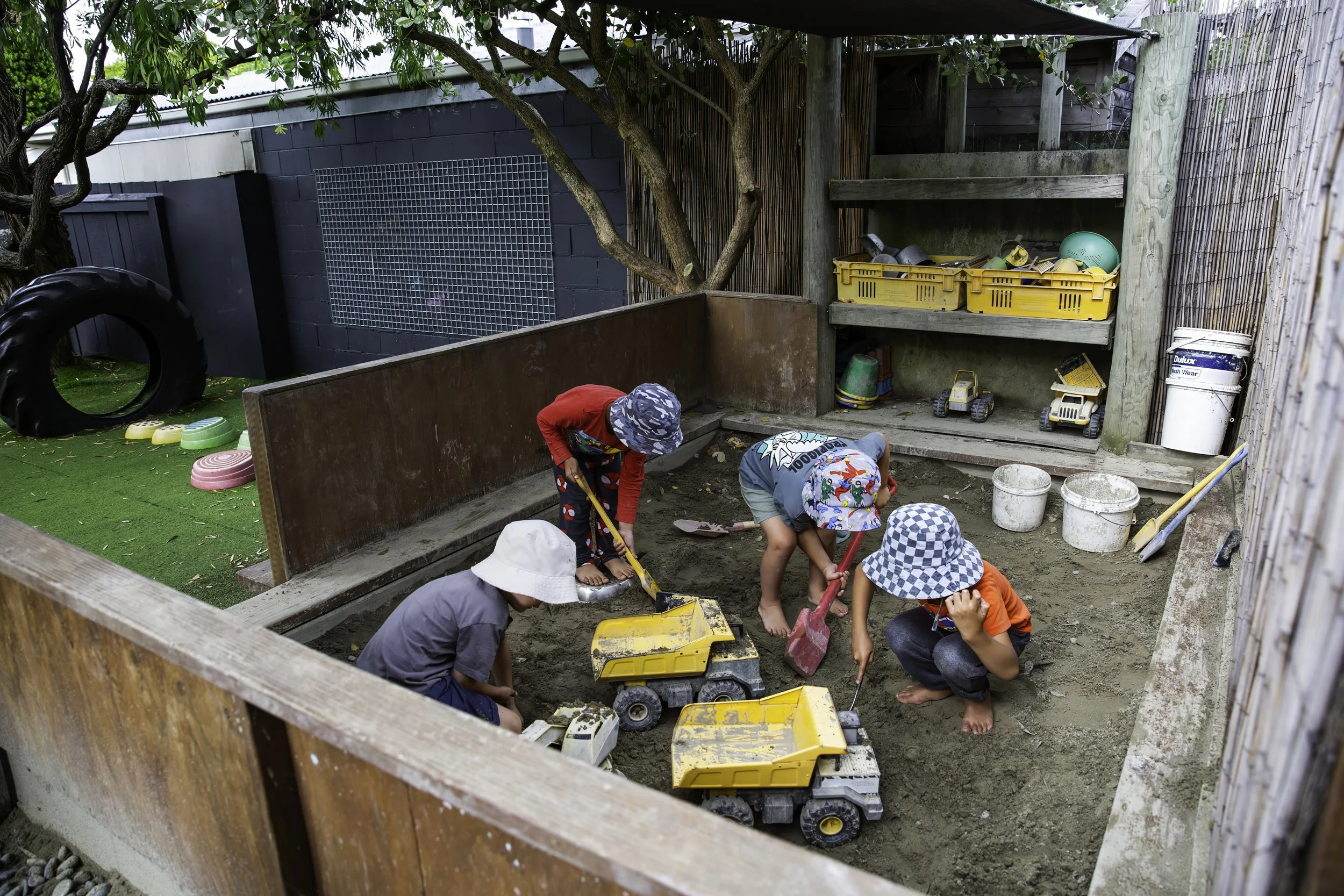 Messy sandpit play gives tamariki time to exercise social skills.
