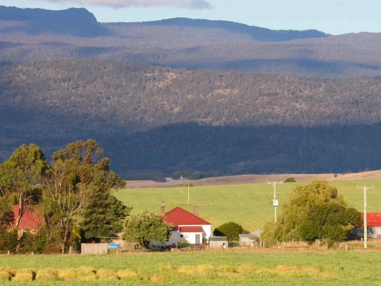 Rural farmland and ranch property representing farm insurance