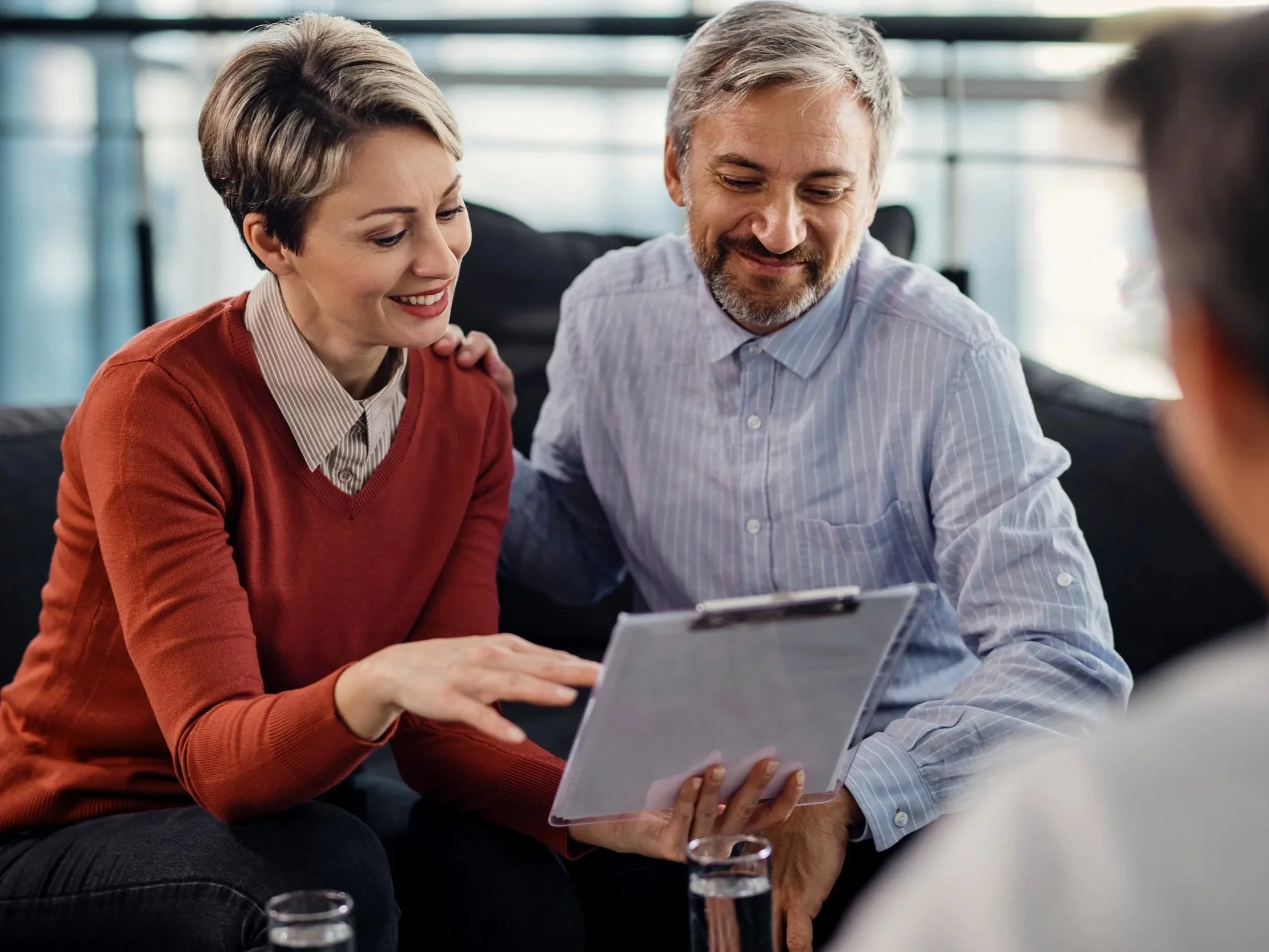 Couple reviewing financial planning options with an advisor