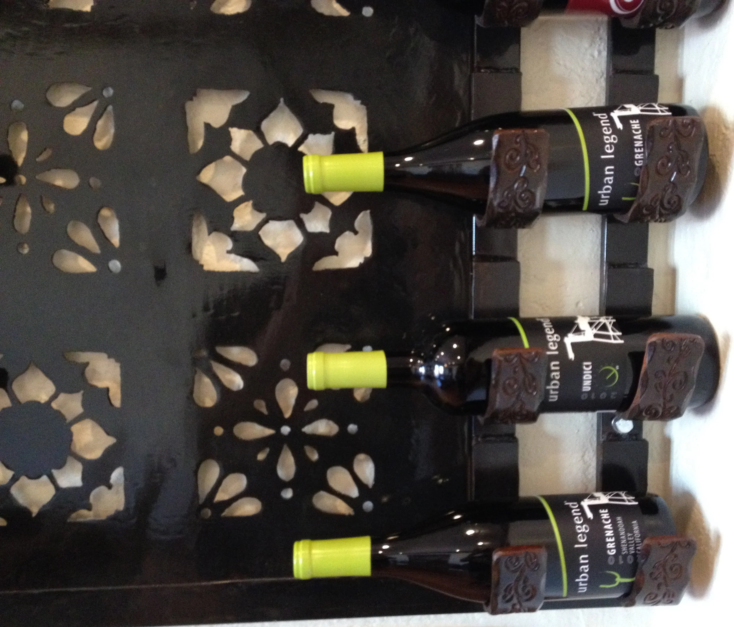   Spanish Style Wine Rack   This wine bottle rack complements the classic aesthetic of the client's 1920s Spanish-style home. It features intricate hand-cut designs inspired by Spanish tile. 