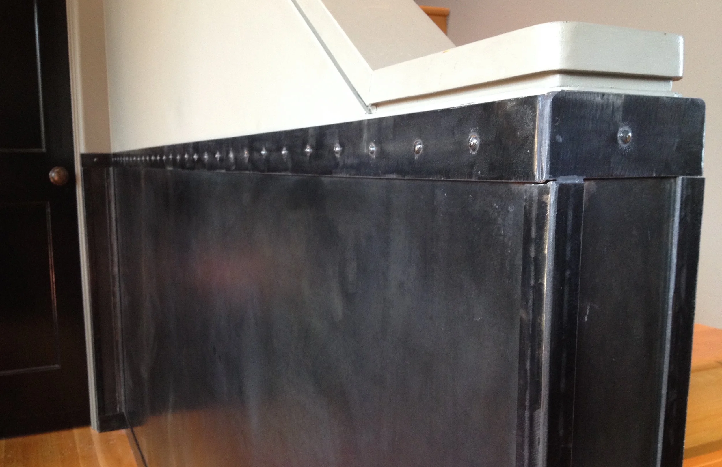   Steel Wainscoting   Custom steel wainscoting for a client in Larkspur, California. Designed with an elegant industrial style, this project jazzed up a previously boring entryway while protecting the walls from nicks and dents caused by daily life w