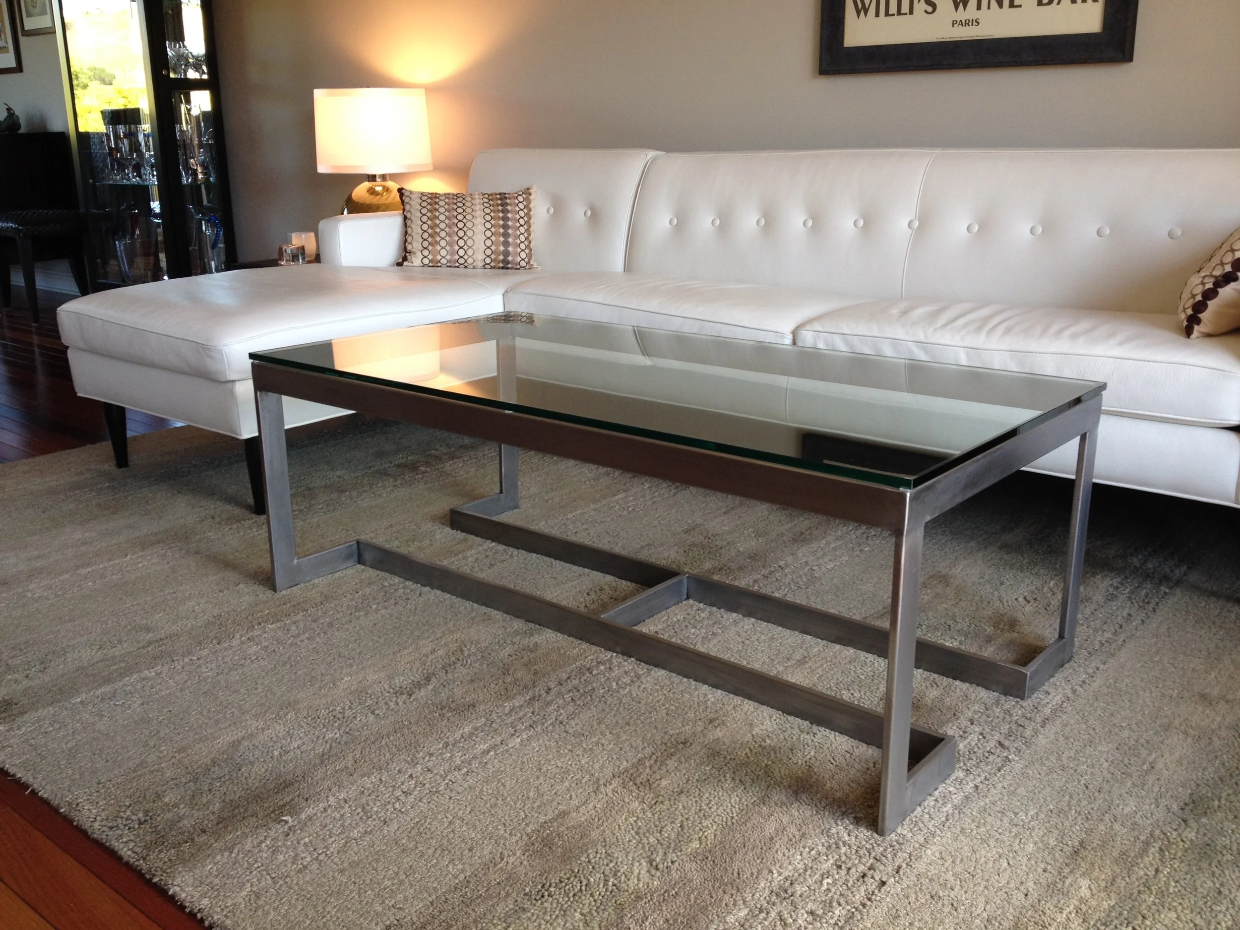   Modern Coffee Table   This table is made from mild steel rectangular tube, with 1/2" thick tempered-glass top. It's bare steel with a hand-grained finish. This table was custom-designed for a client in Mill Valley, Ca. 