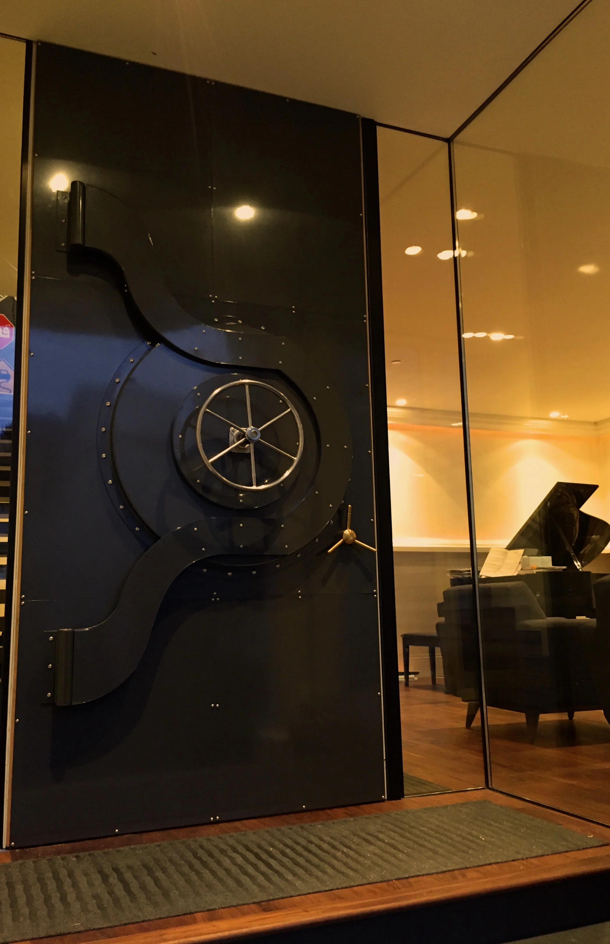   Bank Vault Front Door   This entry door is a one-of-a-kind, elegant conversation piece, modeled after the doors of classic bank vaults. Functional mechanical parts add a touch of whimsy to this North Beach developer’s showcase home.  The house was 