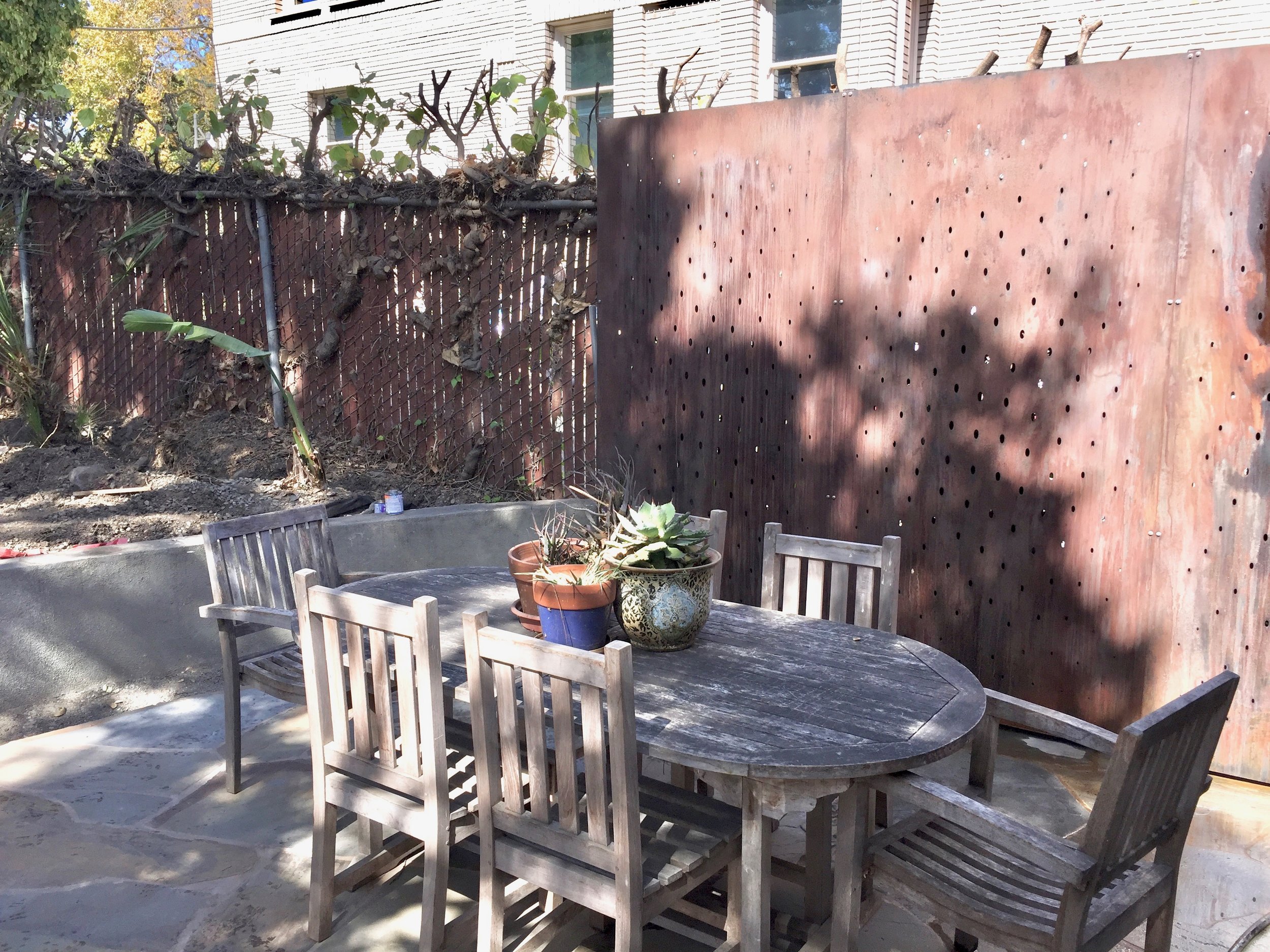   CNC-Cut Privacy Screen   As part of a full backyard renovation, this client's backyard patio&nbsp;needed a visual barrier to hide the busy parking lot on the other side of the fence. These 3 Cor-Ten steel panels were laser cut with a swirling-oval 