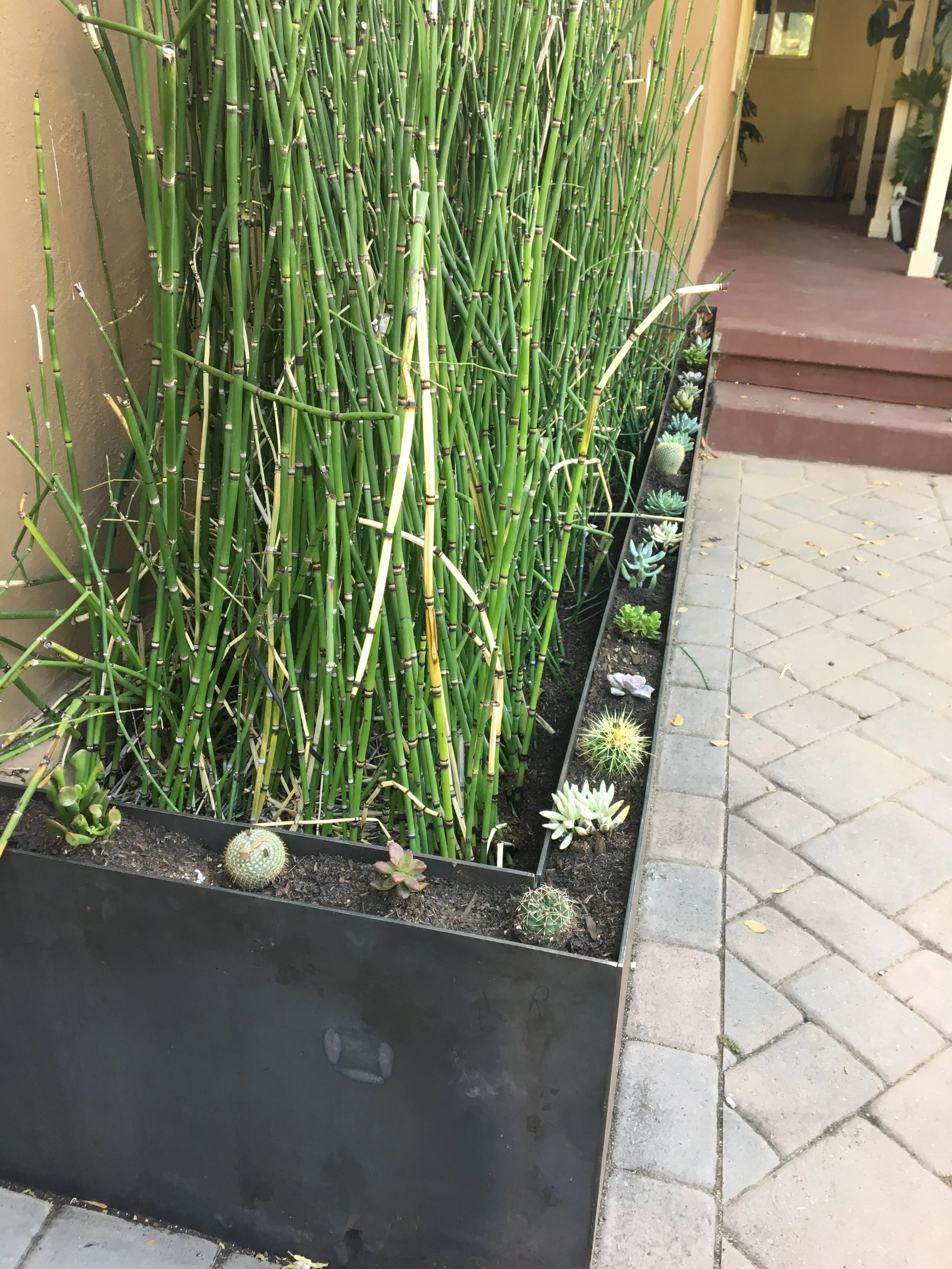   Corten Steel Planter Box   This planter features a double-walled design and LED lighting accents. 