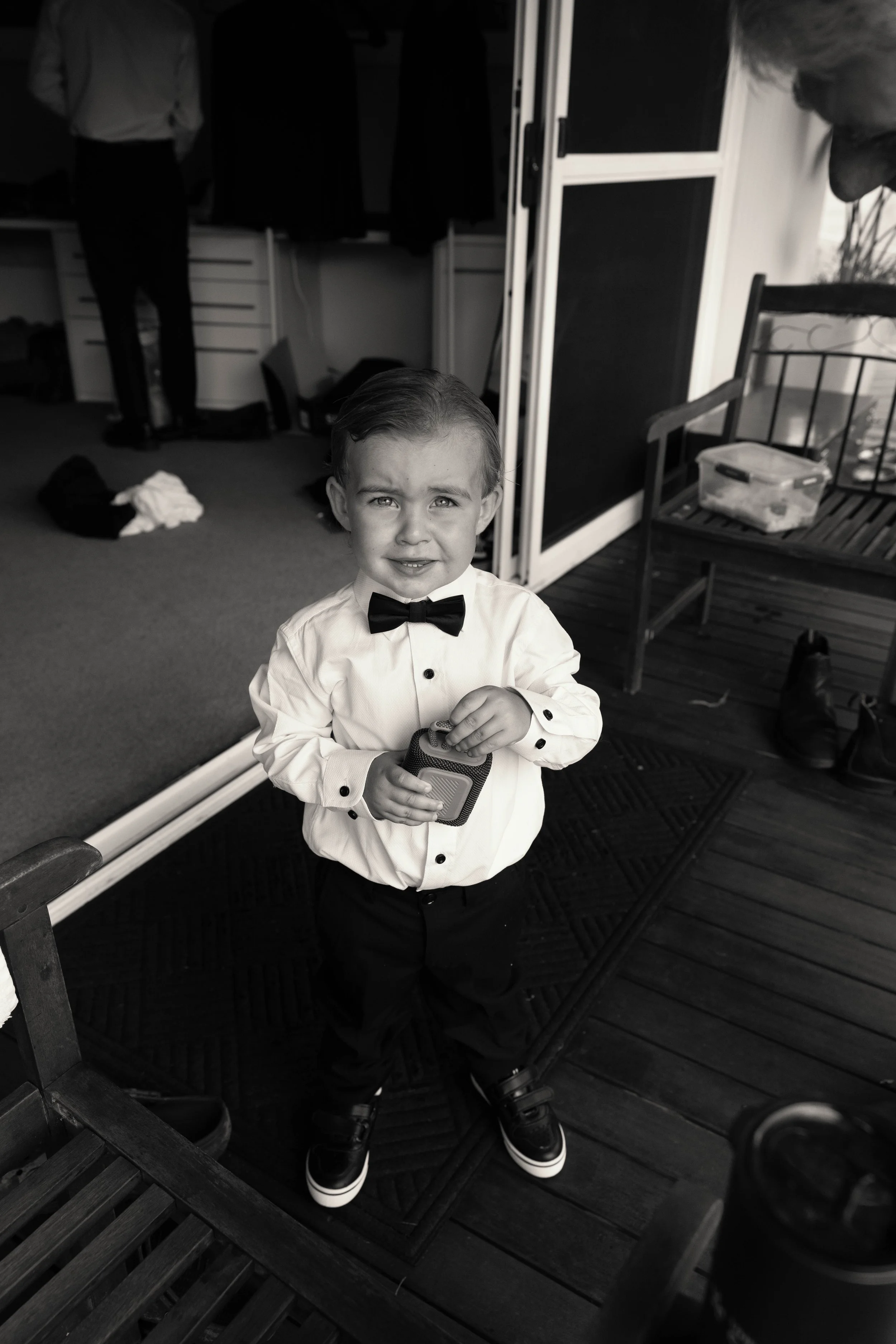 Page boy in a bow tie getting ready, black and white, Longview Farm wedding, Mid North Coast