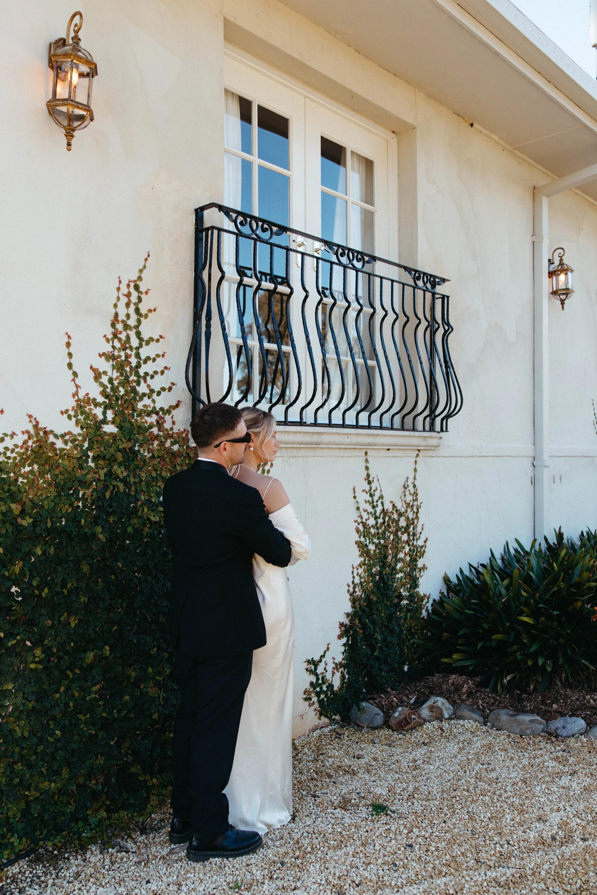 Bride and groom embracing outside Villa Toscana, Hunter Valley wedding